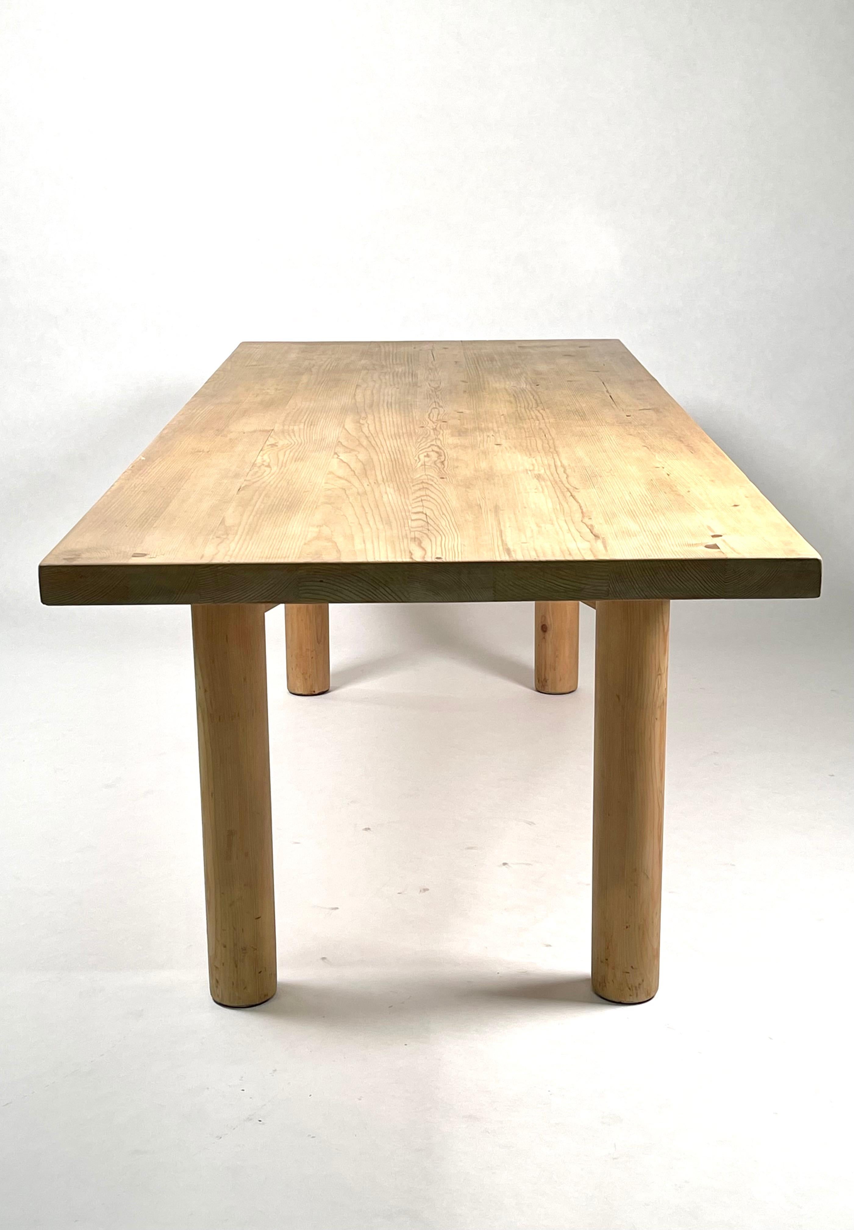 A large & rare dining table in solid acid stained pine.
Designed by Charlotte Perriand for the Méribel Ski resort.
Executed by René Martin, one of Charlotte Perriand's two cabinetmakers in Méribel-les-Allues, France, 1950.
The table has received