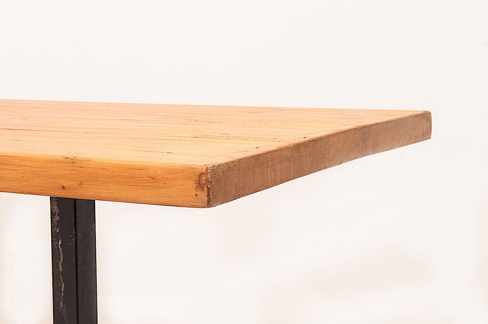 This table in pine from Charlotte Perriand is a large model. We often find the small ones, but this size is more unusual. And we have too, a rare structure, with these two feet ended by kind of cross form. This structure is rarely on the large table