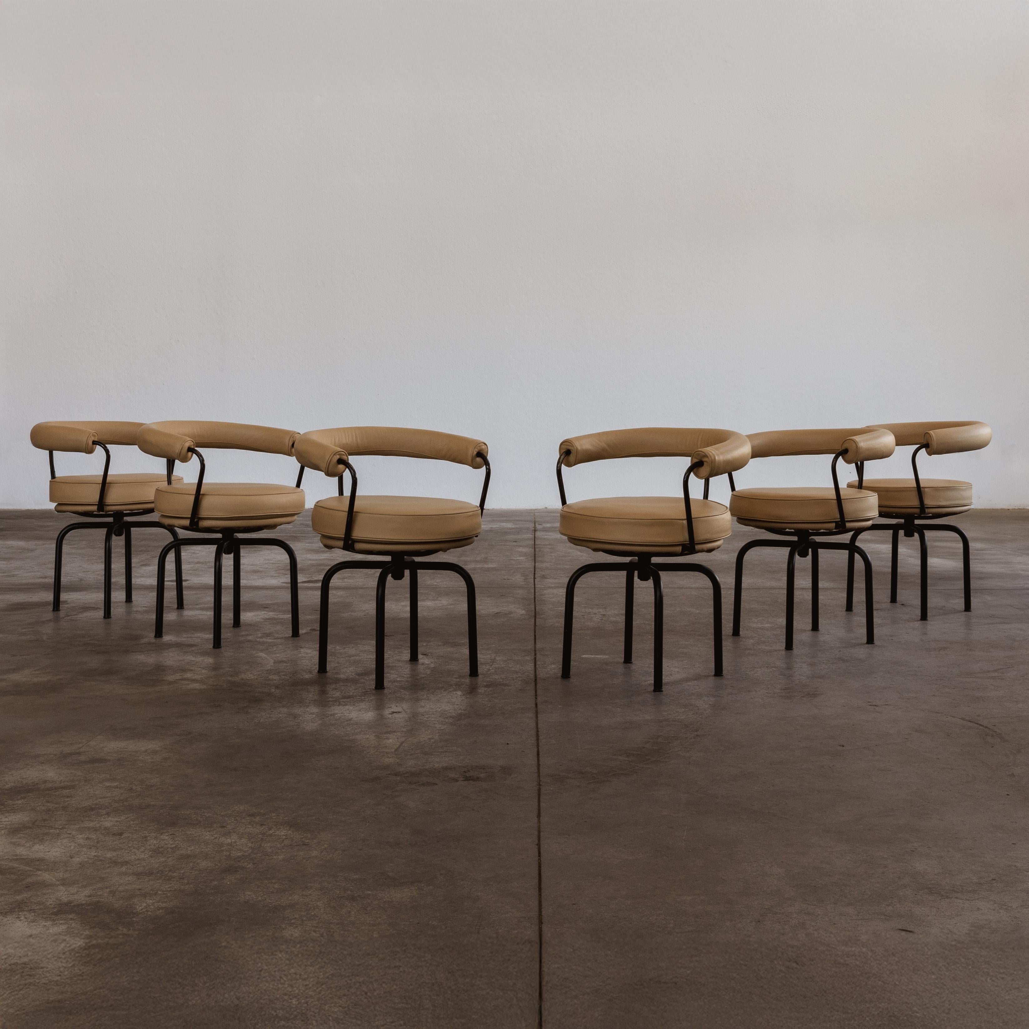 Charlotte Perriand, Pierre Jeanneret and Le Corbusier “LC7” dining chairs for Cassina, sand beige leather and black metal, Italy, 1927, set of six.

An icon with a versatile and functional soul, the 