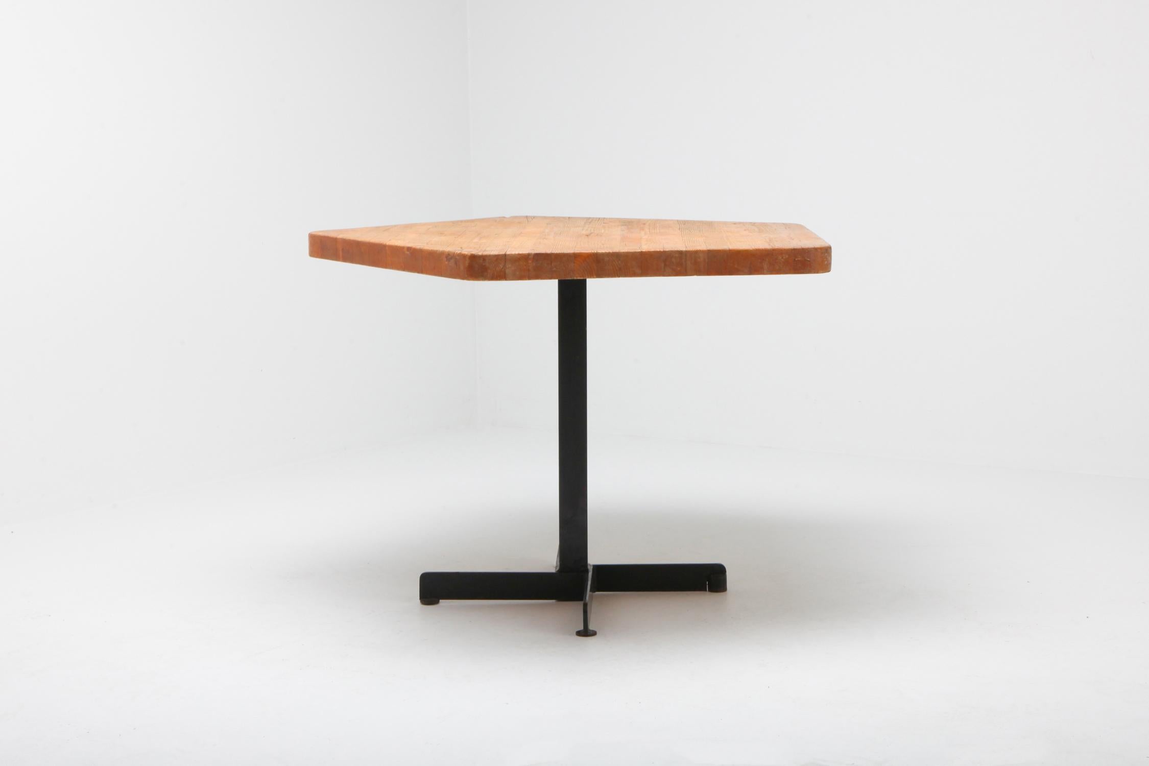 'Les Arcs' pentagonal table by Charlotte Perriand, France, 1960s.

Mid-Century Modern dining / breakfast table by Charlotte Perriand. It has a pentagonal shaped pine top standing on a black metal frame. In original condition with beautiful natural