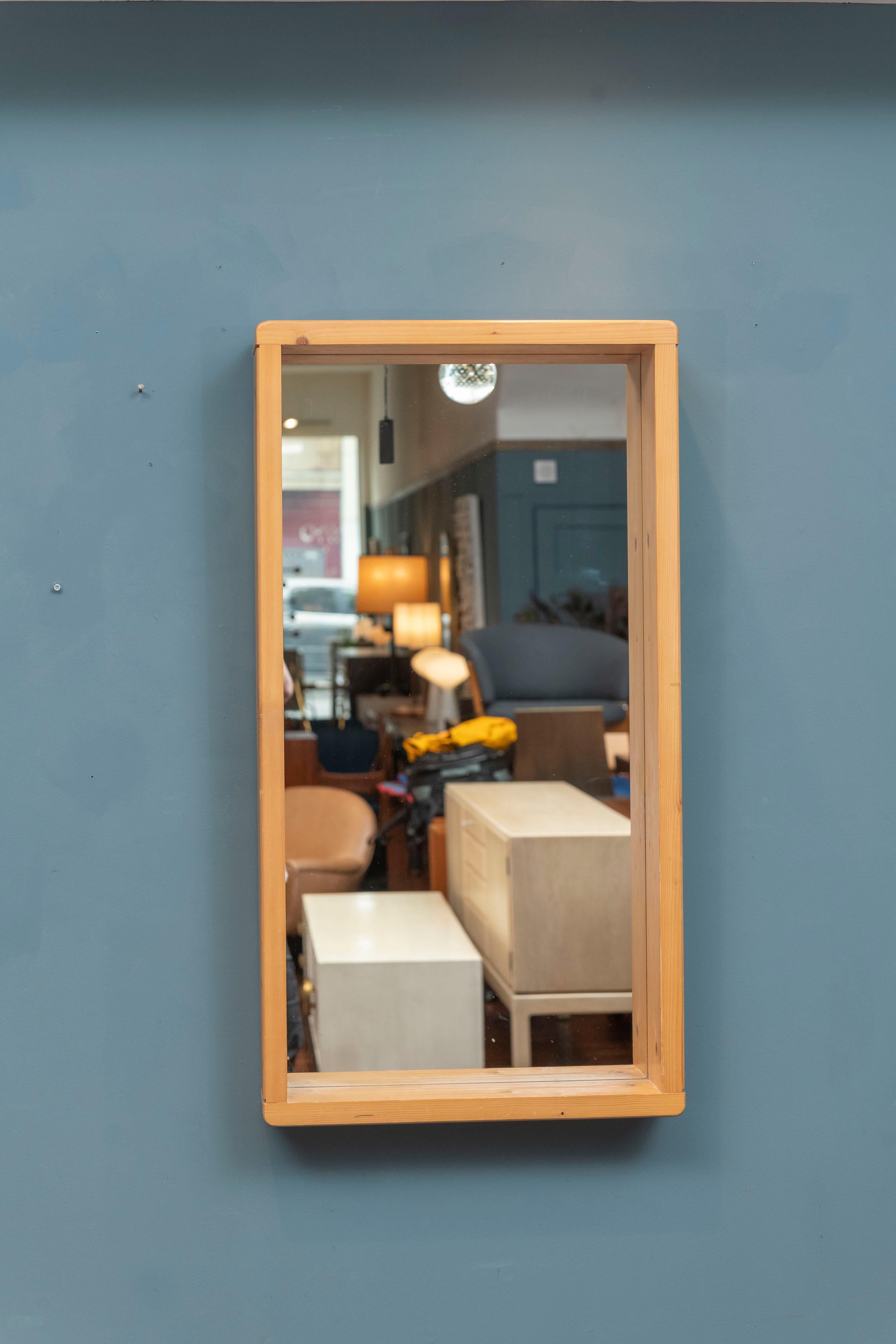 Charlotte Perriand design wall mirror for Les Arcs ski lodge, France. Made from sculpted pine with rounded corner's in very good original condition.