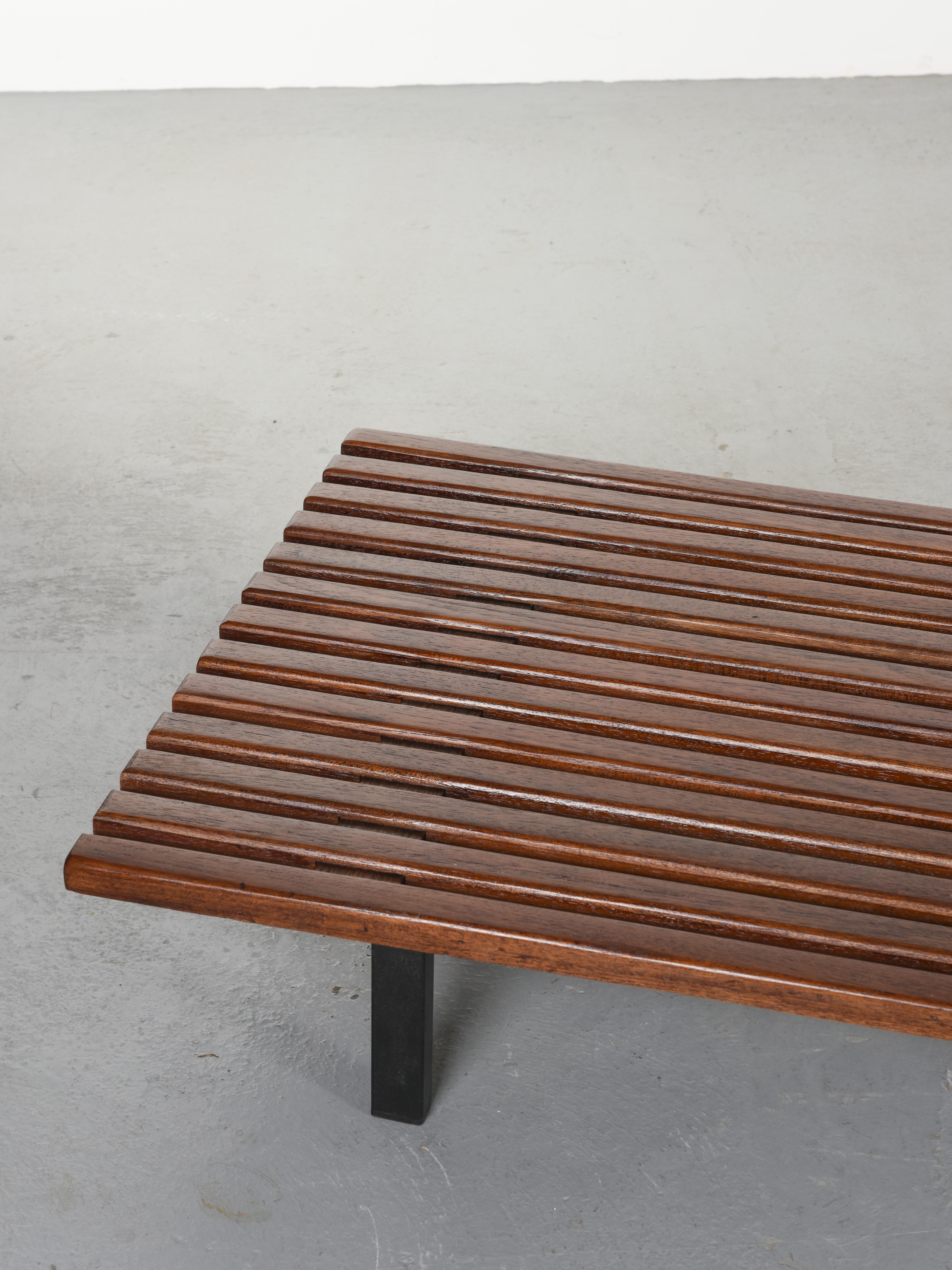 Very long bench by Charlotte Perriand from the Cansado Mining city, Mauritania. Originally made for the flat of Miferma's engineers.

It can be used as a very large coffee table or a modernist low couch with cushions : it is made out of mahogany