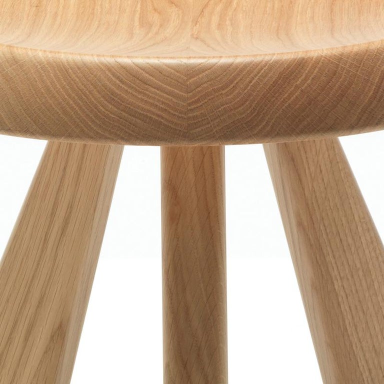 Stool model Meribel designed by Charlotte Perriand in 1953-61. 
Natural oak.
Relaunched by Cassina in 2011.
Manufactured by Cassina in Italy.

Reclaiming simple materials and basic shapes, with an eye to architecture and mountain life, led to