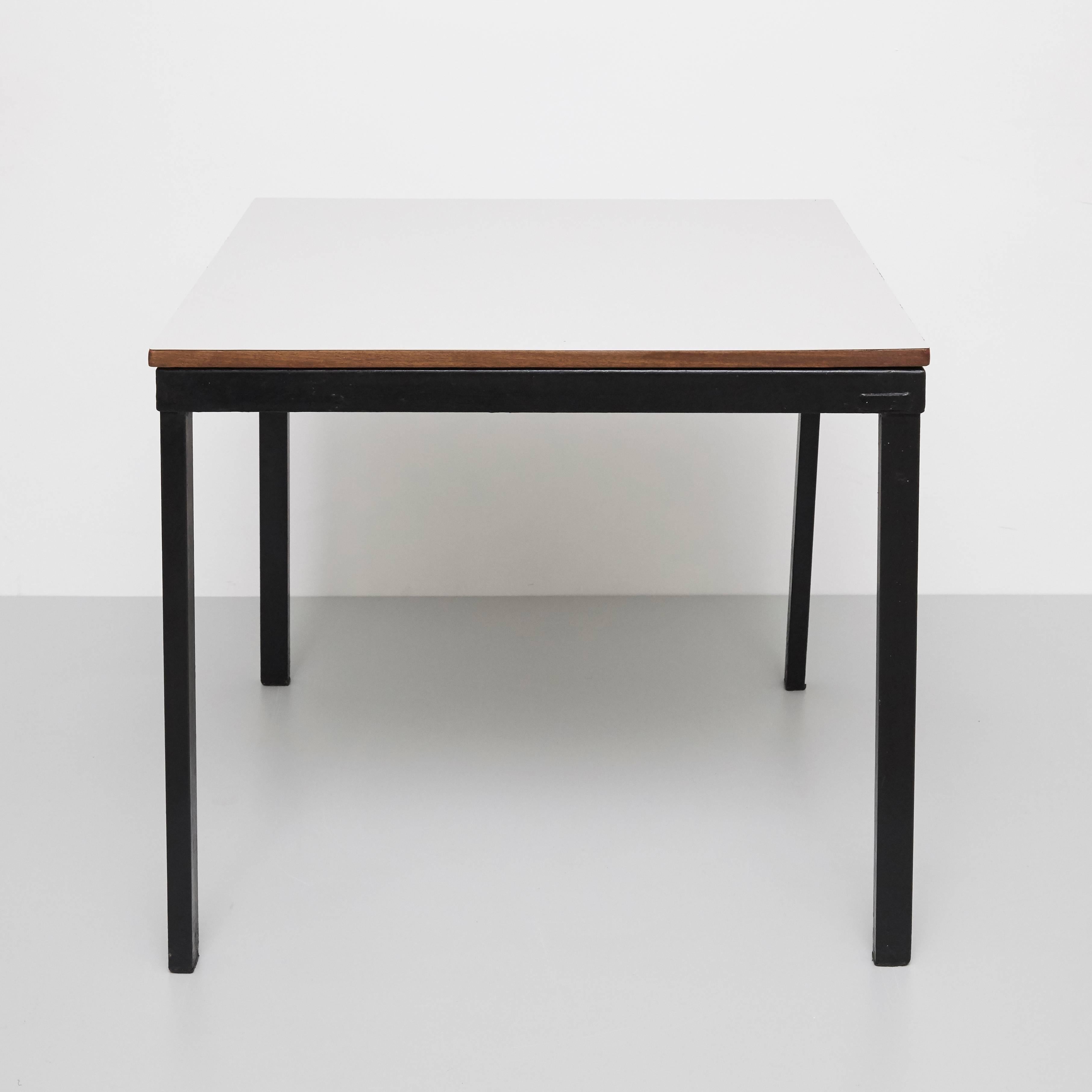 Bridge table designed by Charlotte Perriand, circa 1950 from Cité Cansado, Mauritania, Africa. 

Editioned by Steph Simon, France.

Painted steel, plastic laminate-covered wood.

Measures: 74.3 x 80 x 80 cm

In good original condition, with