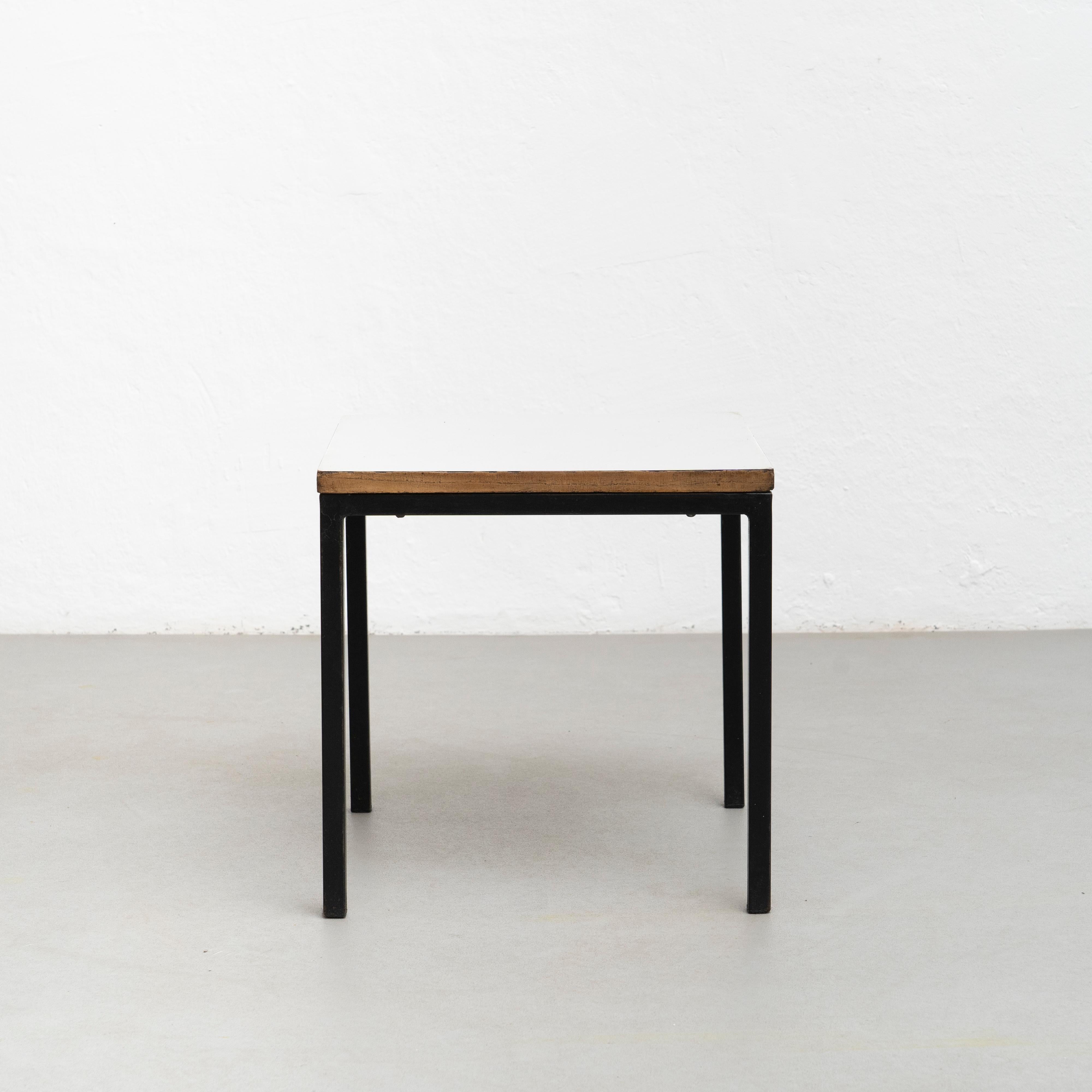 Table designed by Charlotte Perriand, circa 1950 from Cité Cansado, Mauritania, Africa. 

Painted steel, plastic laminate-covered wood.

Measures: 74.3 x 80 x 80 cm

In good original condition, with minor wear consistent with age and use,