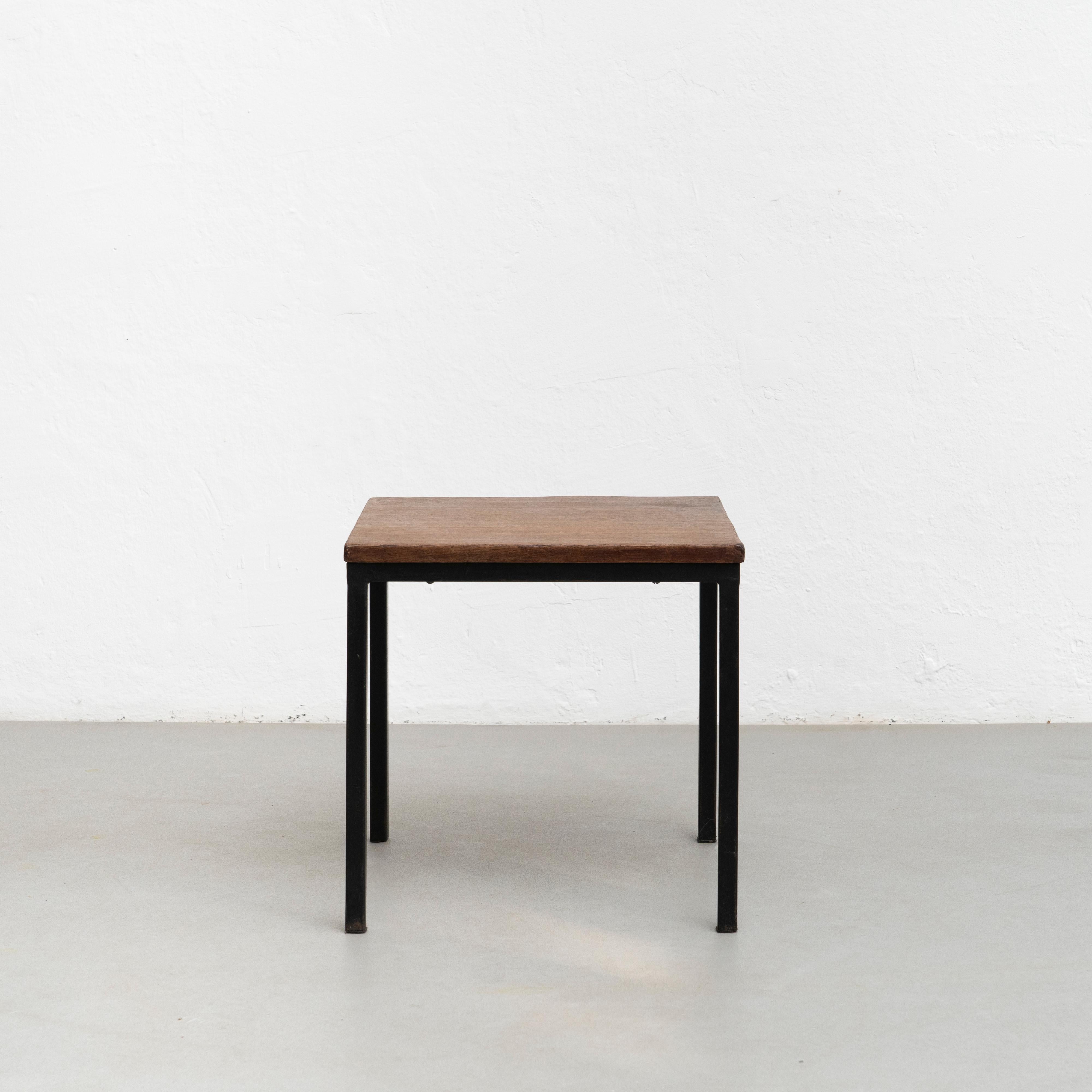 Low table designed by Charlotte Perriand, circa 1950 from Cité Cansado, Mauritania, Africa. 

Painted steel, wood.

Measures: 74.3 x 80 x 80 cm

In good original condition, with minor wear consistent with age and use, preserving a beautiful
