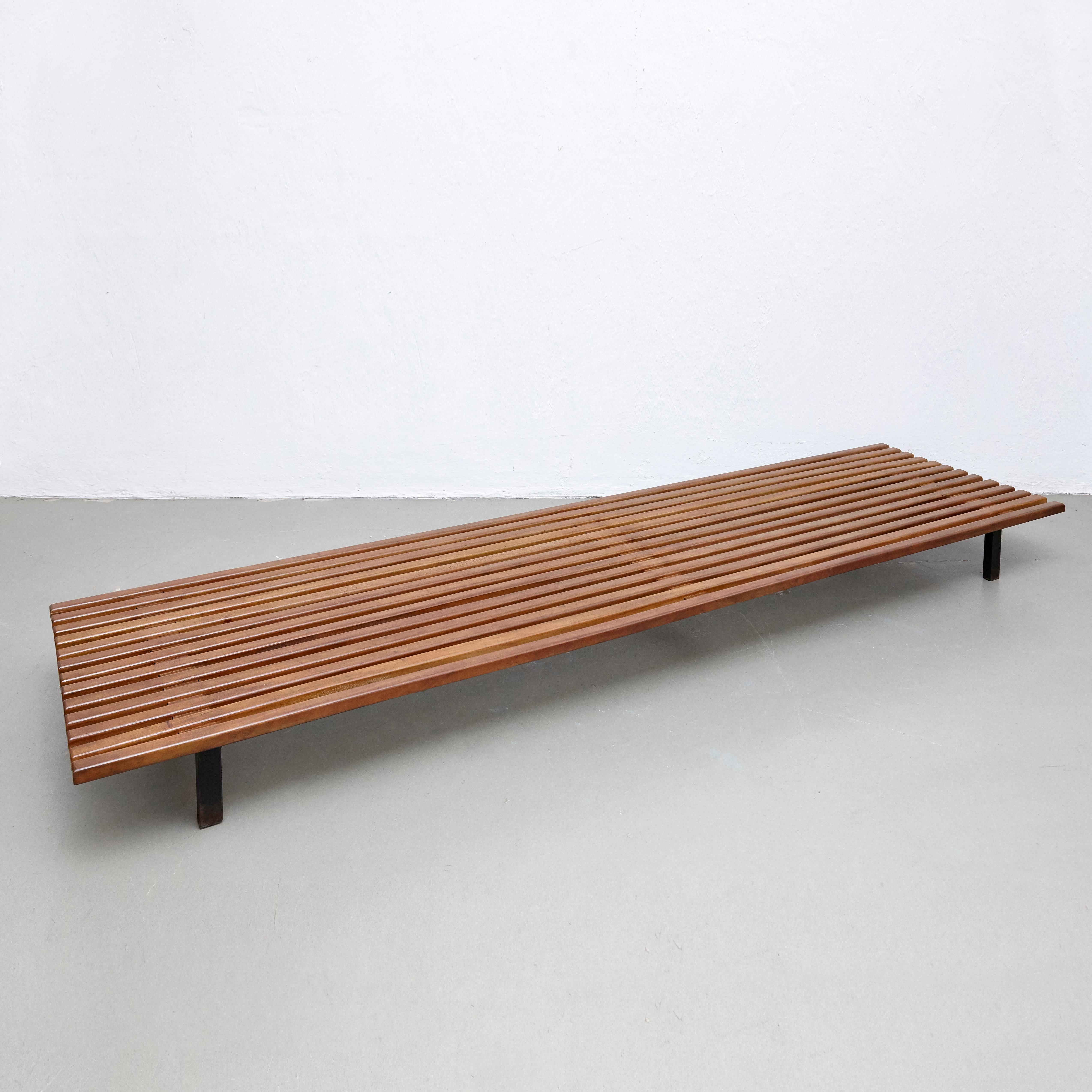 Bench designed by Charlotte Perriand, circa 1950.
This model is with 13 slats of wood.
Edited by Steph Simon.

Wood, metal frame legs.

Provenance: Cansado, Mauritania (Africa).

In good original condition, with minor wear consistent with