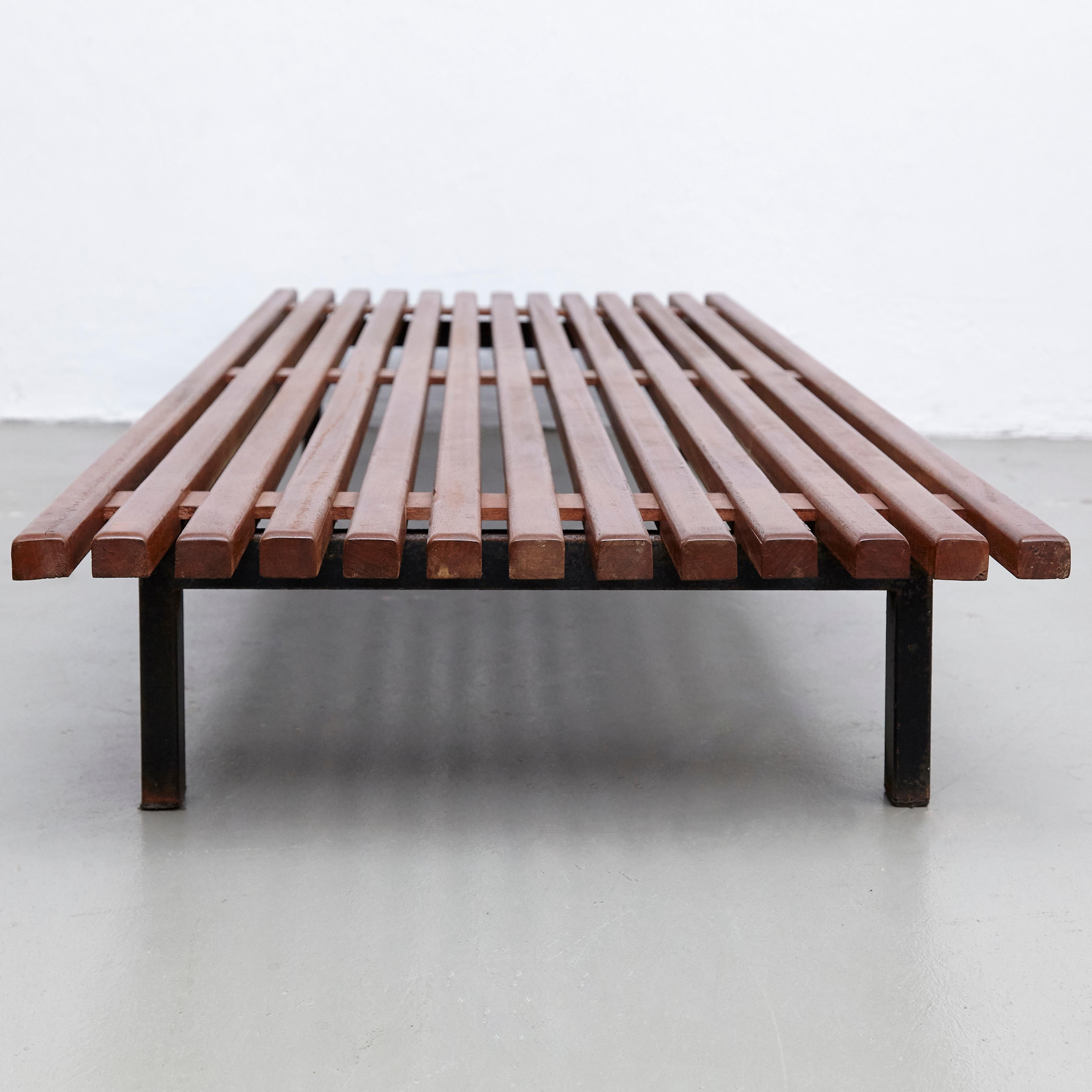 Bench designed by Charlotte Perriand, circa 1950.
Edited by Steph Simon (France)

Wood, metal frame legs.

Provenance: Cansado, Mauritania (Africa).

In original condition, with minor wear consistent with age and use, preserving a beautiful