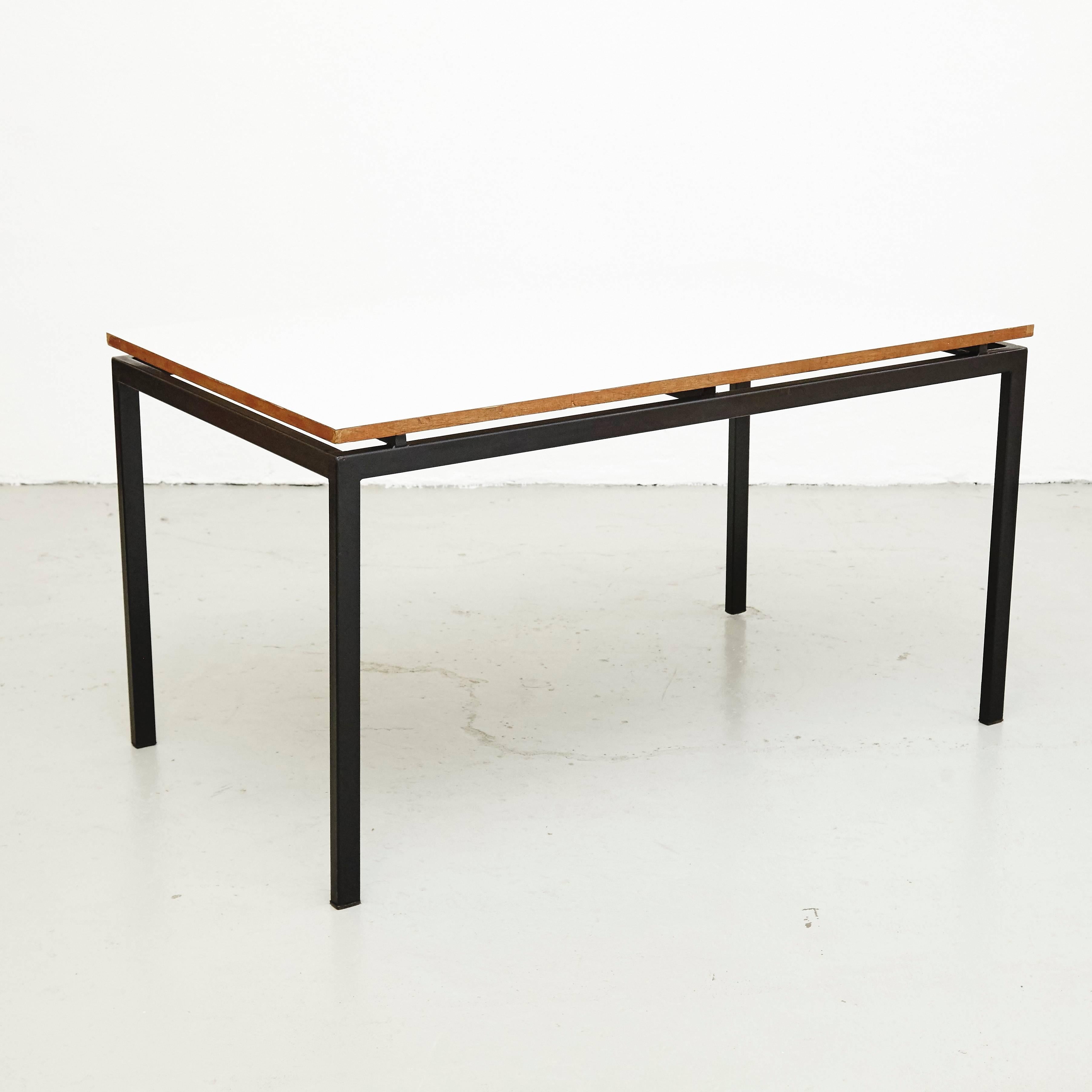 Table designed by Charlotte Perriand, circa 1950.

Wood, metal frame legs.

Provenance: Cansado, Mauritania (Africa).

In good condition, with minor wear consistent with age and use, preserving a beautiful patina.

Charlotte Perriand