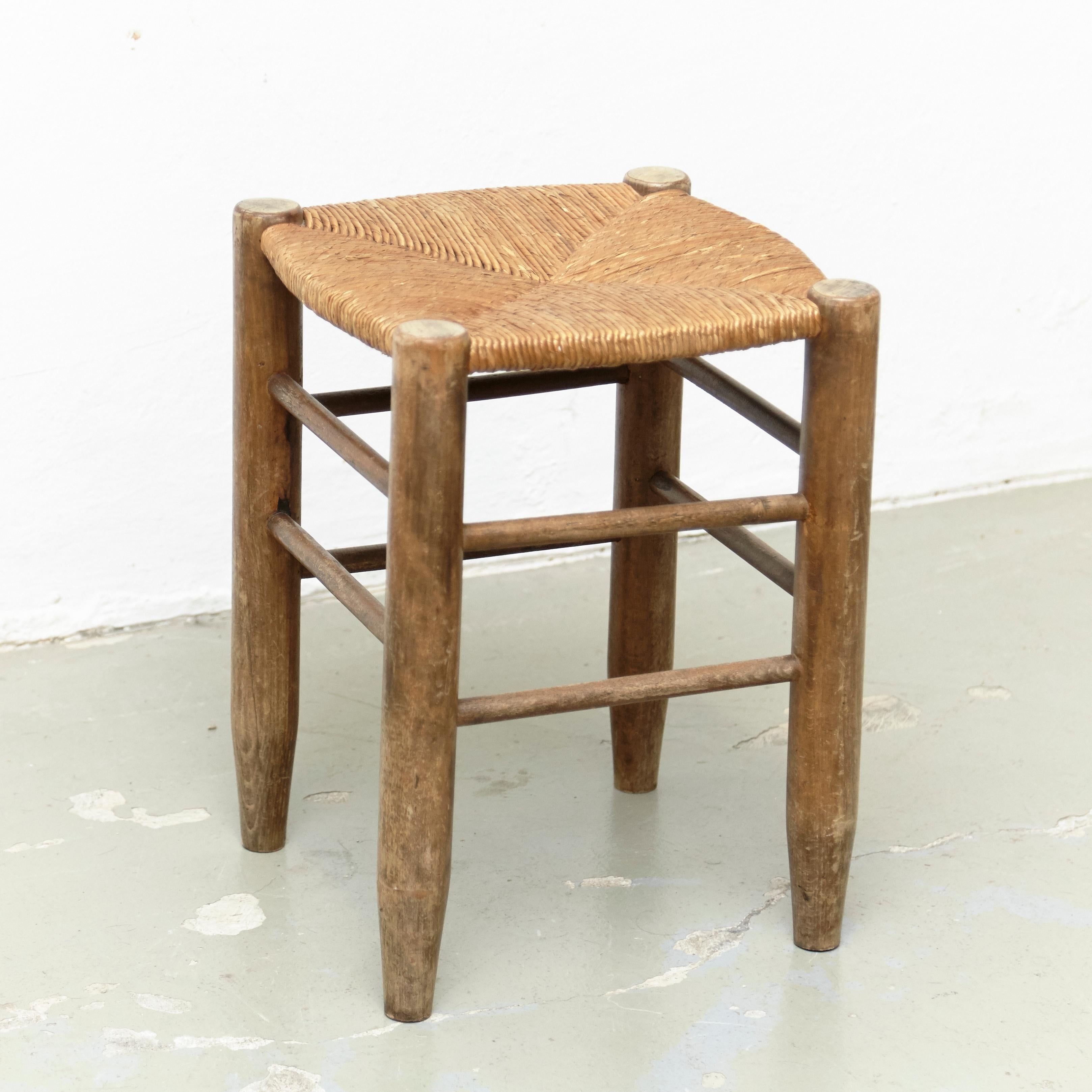 Stool designed by Charlotte Perriand, circa 1950.
Manufactured in France.
Wood and rattan. 

In original condition, with minor wear consistent with age and use, preserving a beautiful patina.

Charlotte Perriand (1903-1999) She was born in