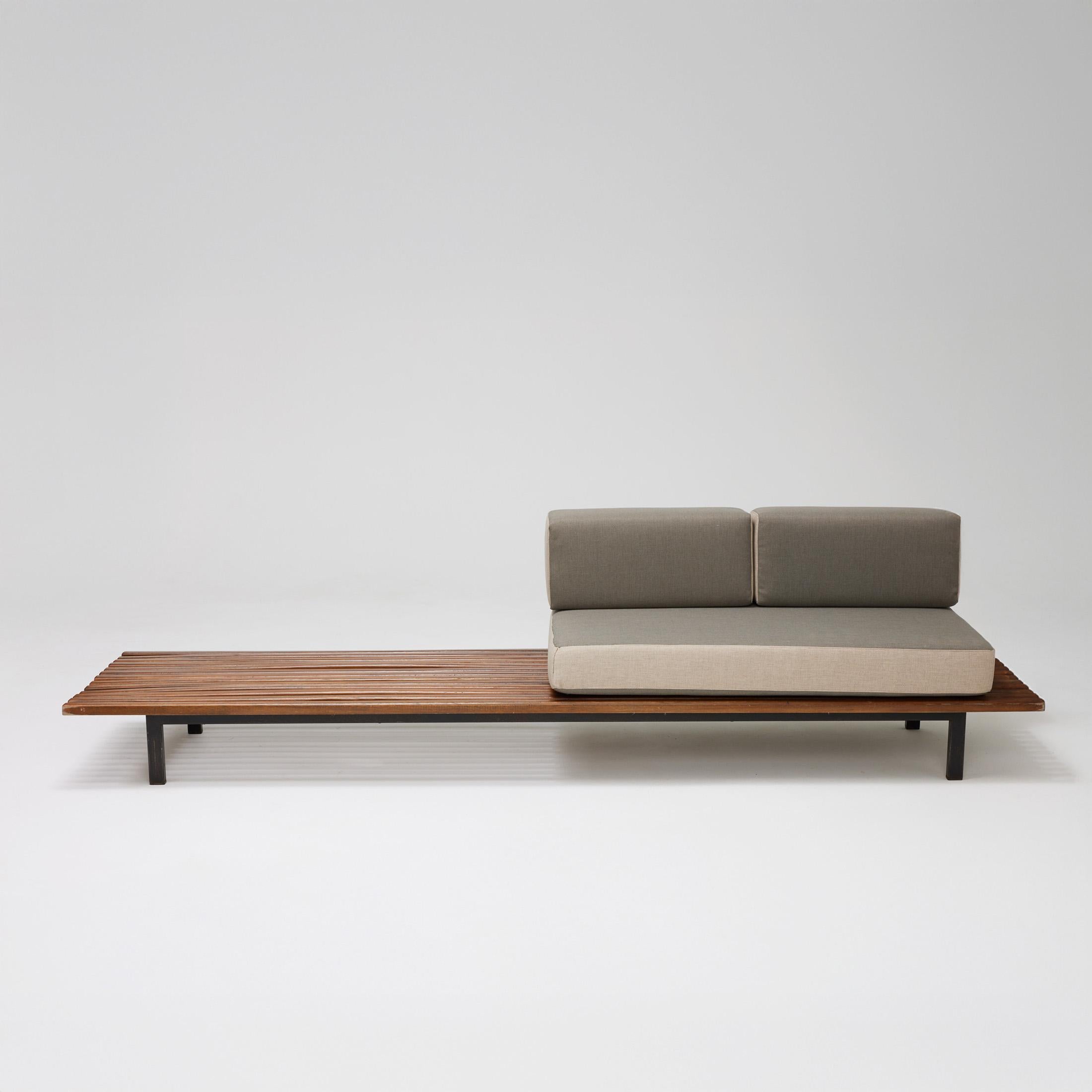 Bench designed by Charlotte Perriand.
Edited by Steph Simon.

Provenance: Cansado, Mauritania (Africa).

In original condition with minor wear consistent of age and use, preserving a beautiful patina.

Cushions have been made new.

Materials: 
Wood,