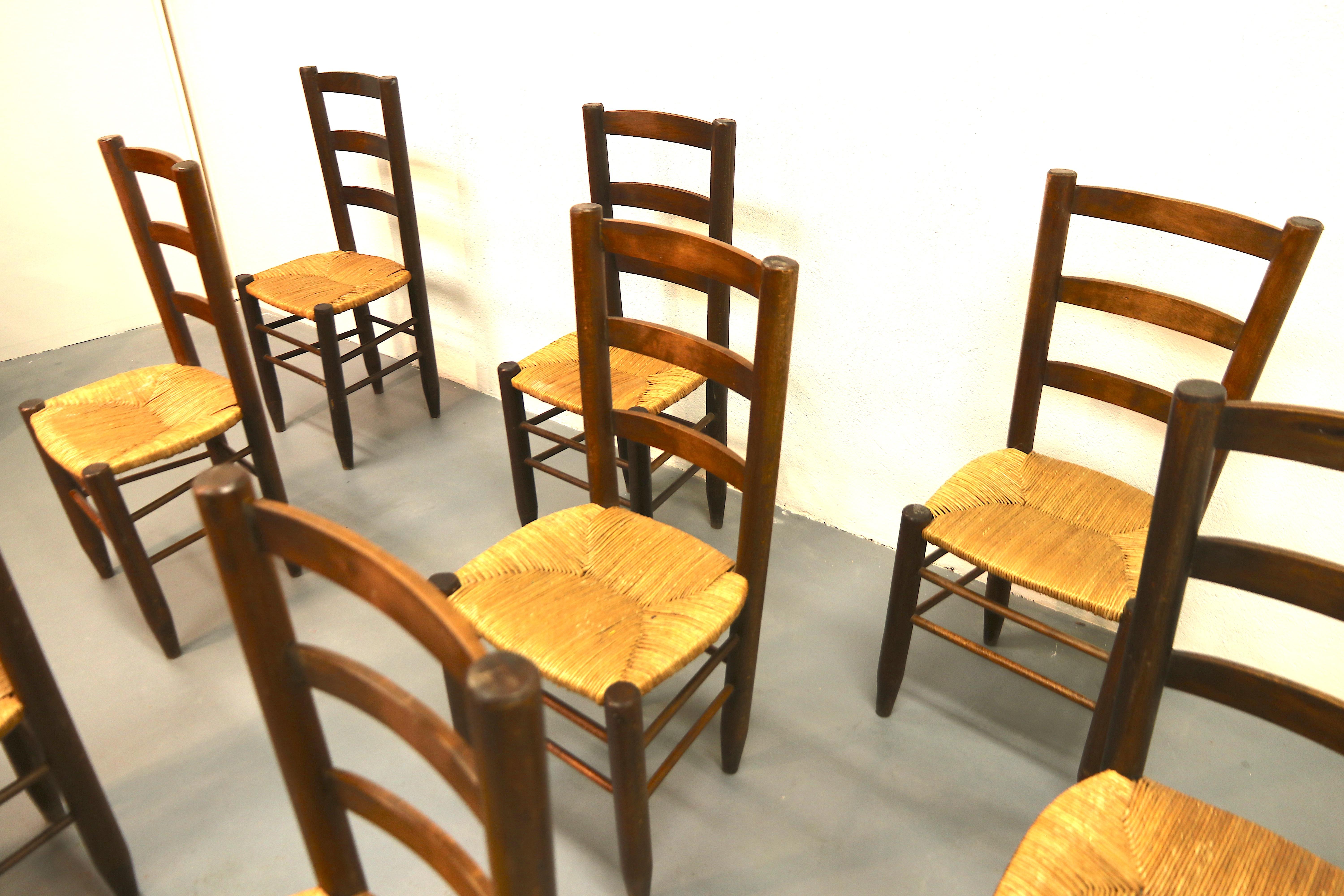 French Charlotte Perriand Model No. 19 Set of 8 Solid Wood and Rush Dining Room Chairs For Sale