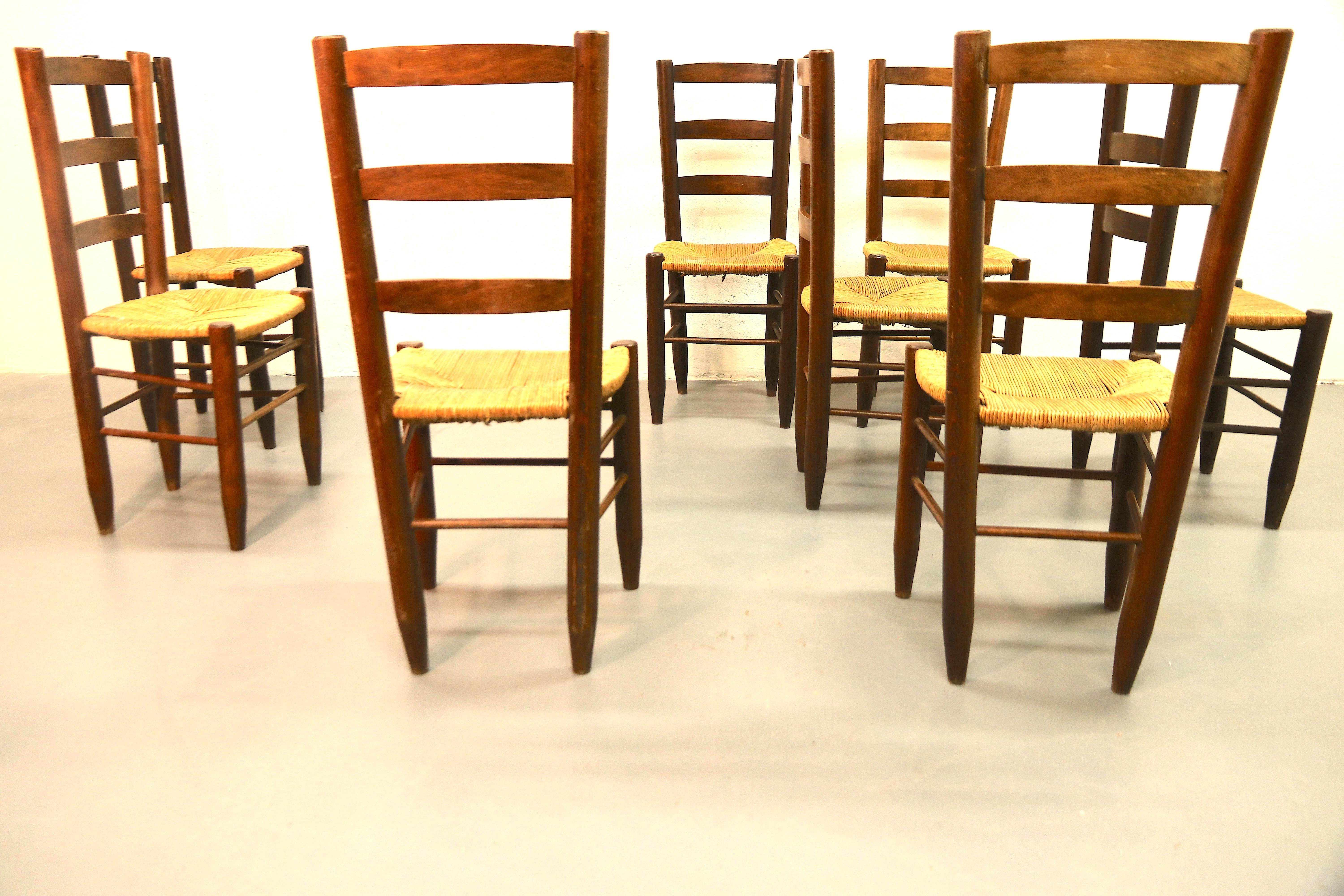 Charlotte Perriand Model No. 19 Set of 8 Solid Wood and Rush Dining Room Chairs In Good Condition For Sale In Amsterdam, NL