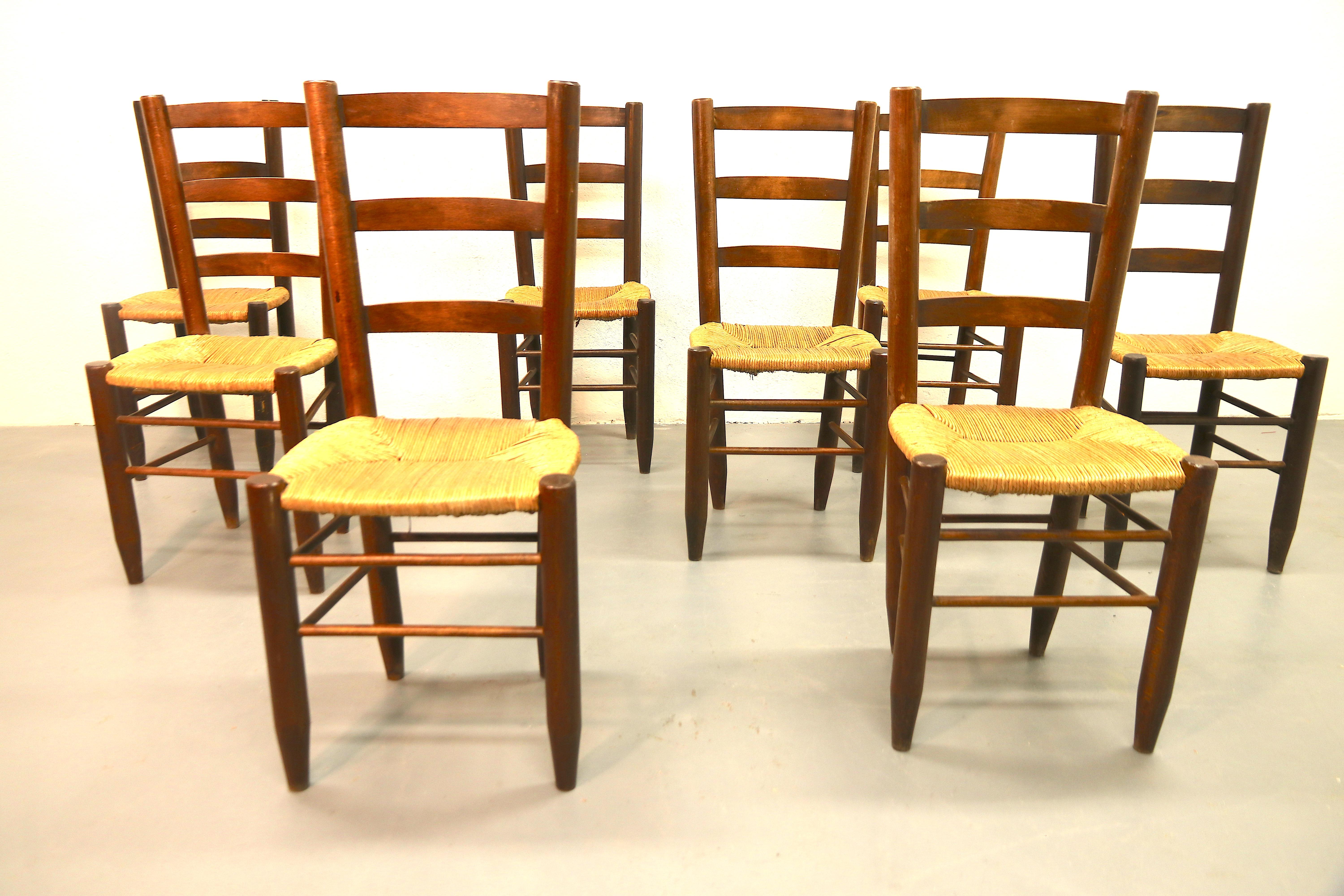 Mid-20th Century Charlotte Perriand Model No. 19 Set of 8 Solid Wood and Rush Dining Room Chairs For Sale