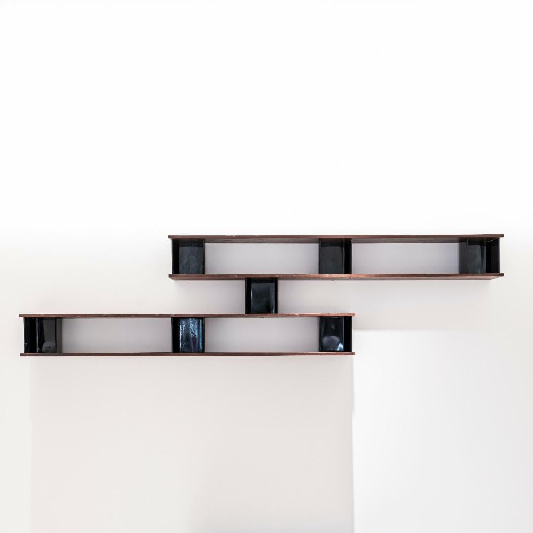 ‘Nuage’ wall-mounted shelves from Cité Cansado.
Designed by Charlotte Perriand.
Mahogany-veneered wood, painted steel, aluminum.

Metal produced by Métal Meubles and wood produced by Négroni, France. Issued by Galerie Steph Simon, Paris,