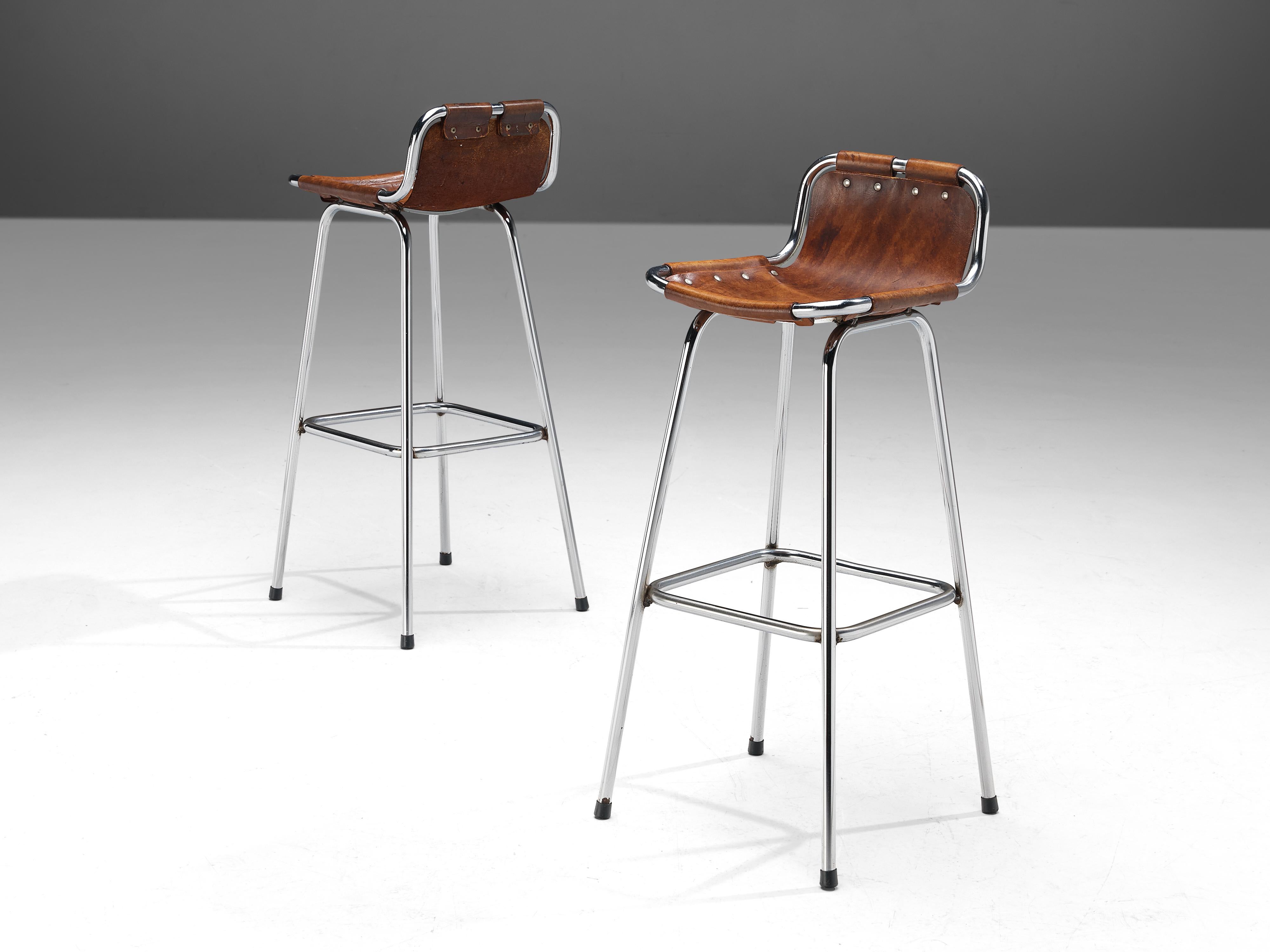 Charlotte Perriand, bar stools, lacquered steel, leather, France, circa 1970. 

Pair of stools of the famous model 'Les Arcs' by French architect and designer Charlotte Perriand. The simplistic design consist of a tubular steel frame with a