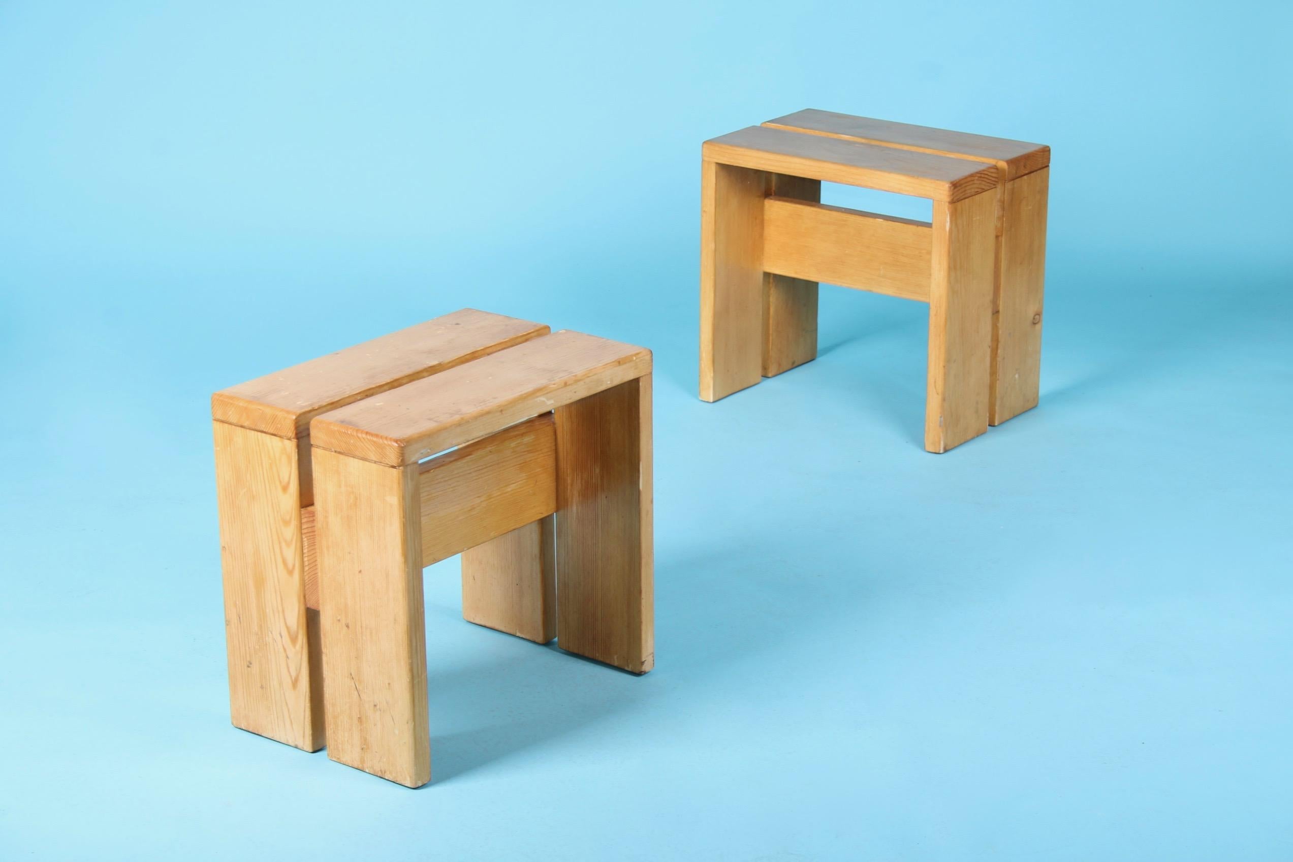 Charlotte Perriand pair of les arcs stools.