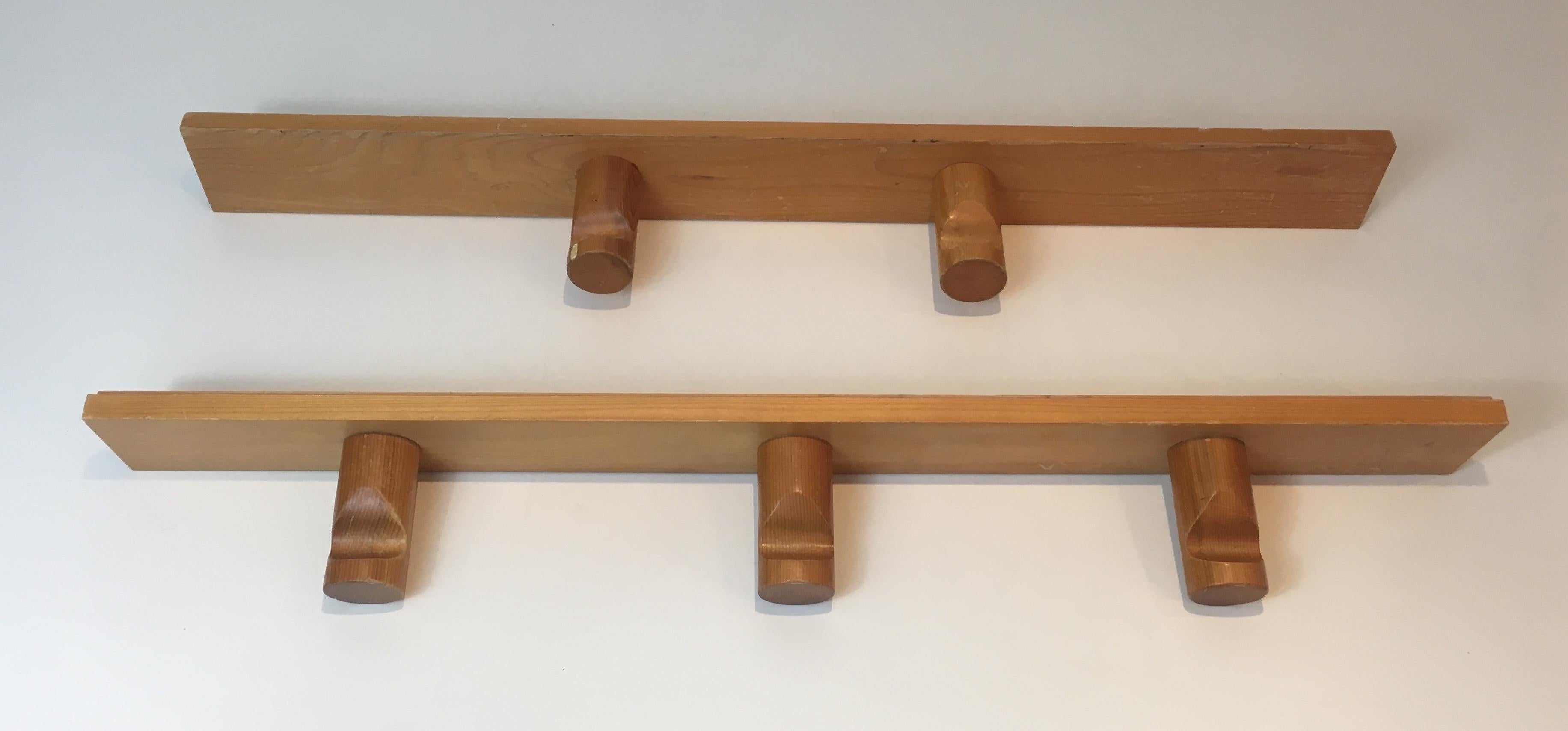 This pair of wall coat hangers is made of pine. This is a French work by famous designer Charlotte Perriand for les Arcs, circa 1960