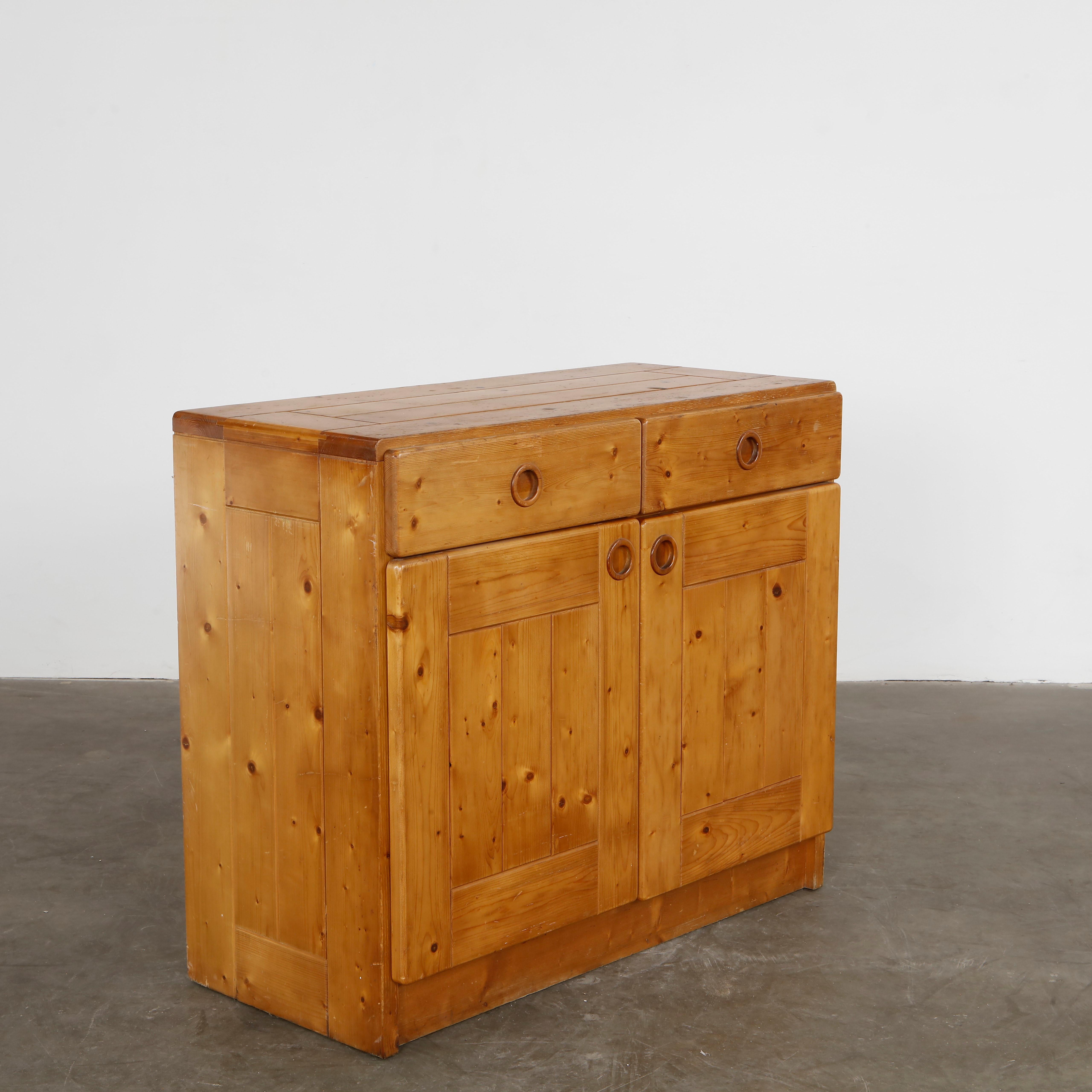Pine wood sideboard with two drawers and two doors, reflecting rustic modernism and utility. Height: 33.5 in. Width: 39 in. Depth: 18 in.