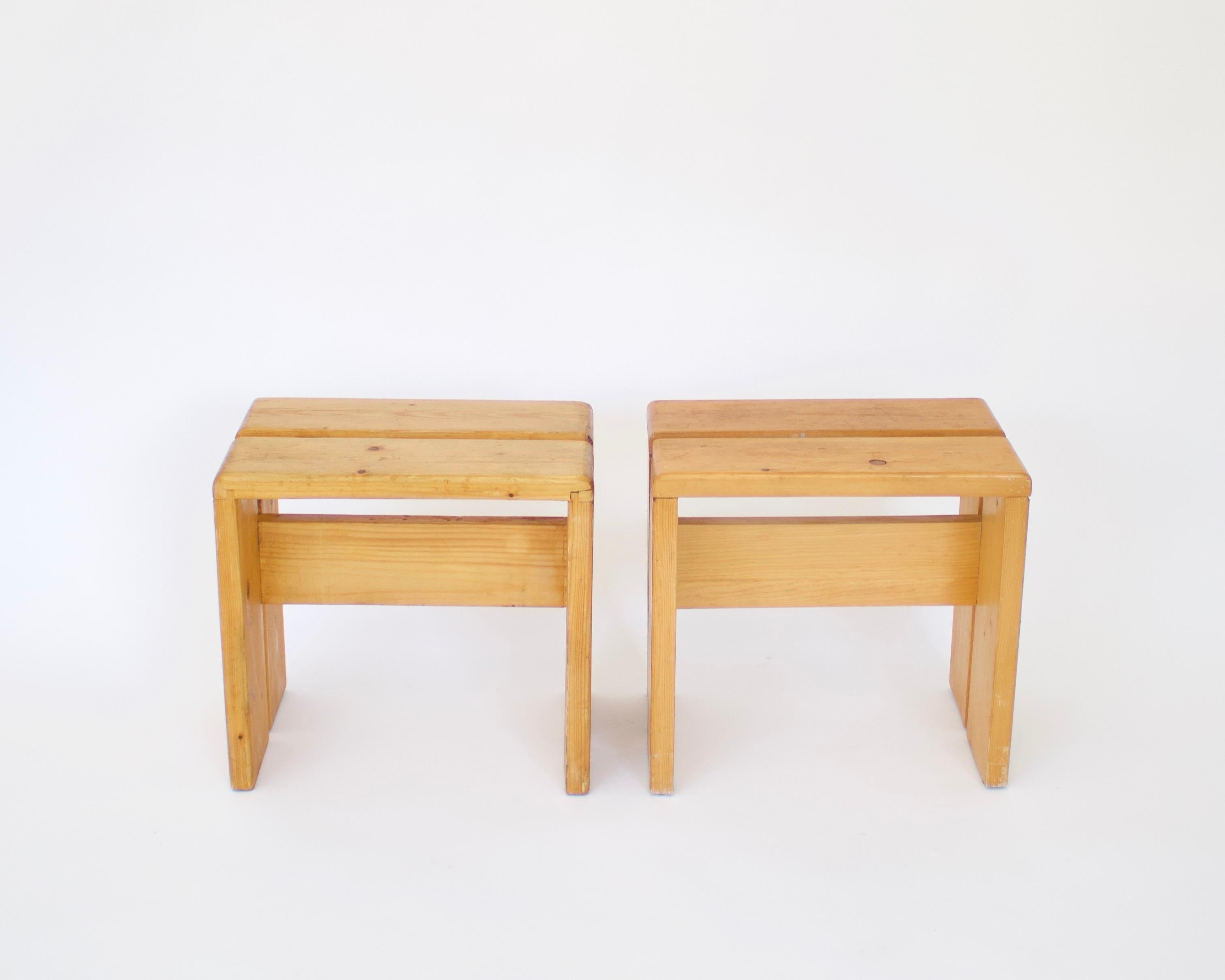 Charlotte Perriand pair of iconic pine wood stools or tables for Les Arcs ski resort, circa 1960.
Manufactured in France. 
These are the iconic Charlotte Perriand simple and straightforward pine stools used commonly throughout the ski resort.