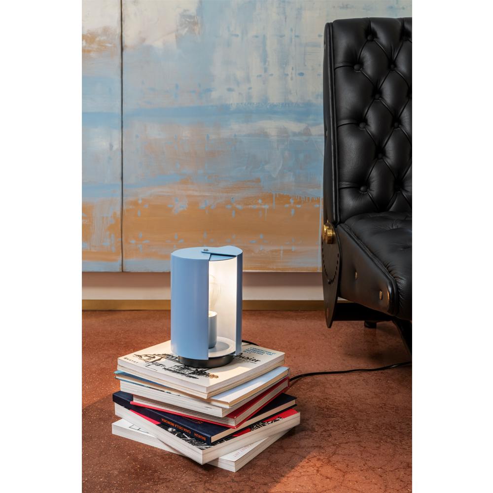 Charlotte Perriand 'Pivotante À Poser' table lamp in light blue. Originally designed in 1950 by the iconic Charlotte Perriand, these newly produced authorized re-editions are still made in France by Nemo with the highest level of integrity and