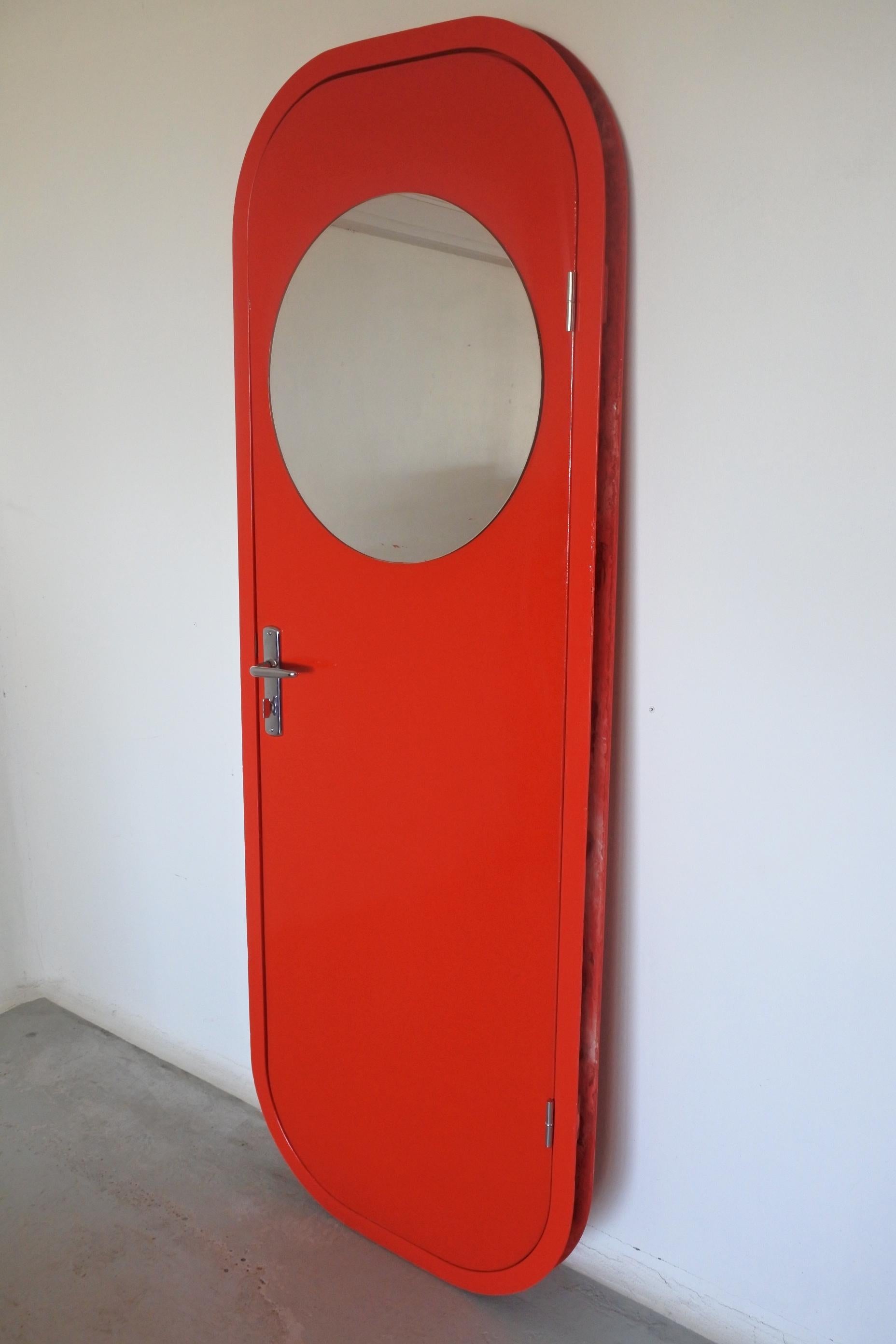 Charlotte Perriand.
Complete door with door frame, original mirror, original handles and hinges.
Red lacquered fiberglass and chromed metal.

Designed Les Arcs ski resort in the french Alps. 
This door was installed in an apartment in Les Arcs