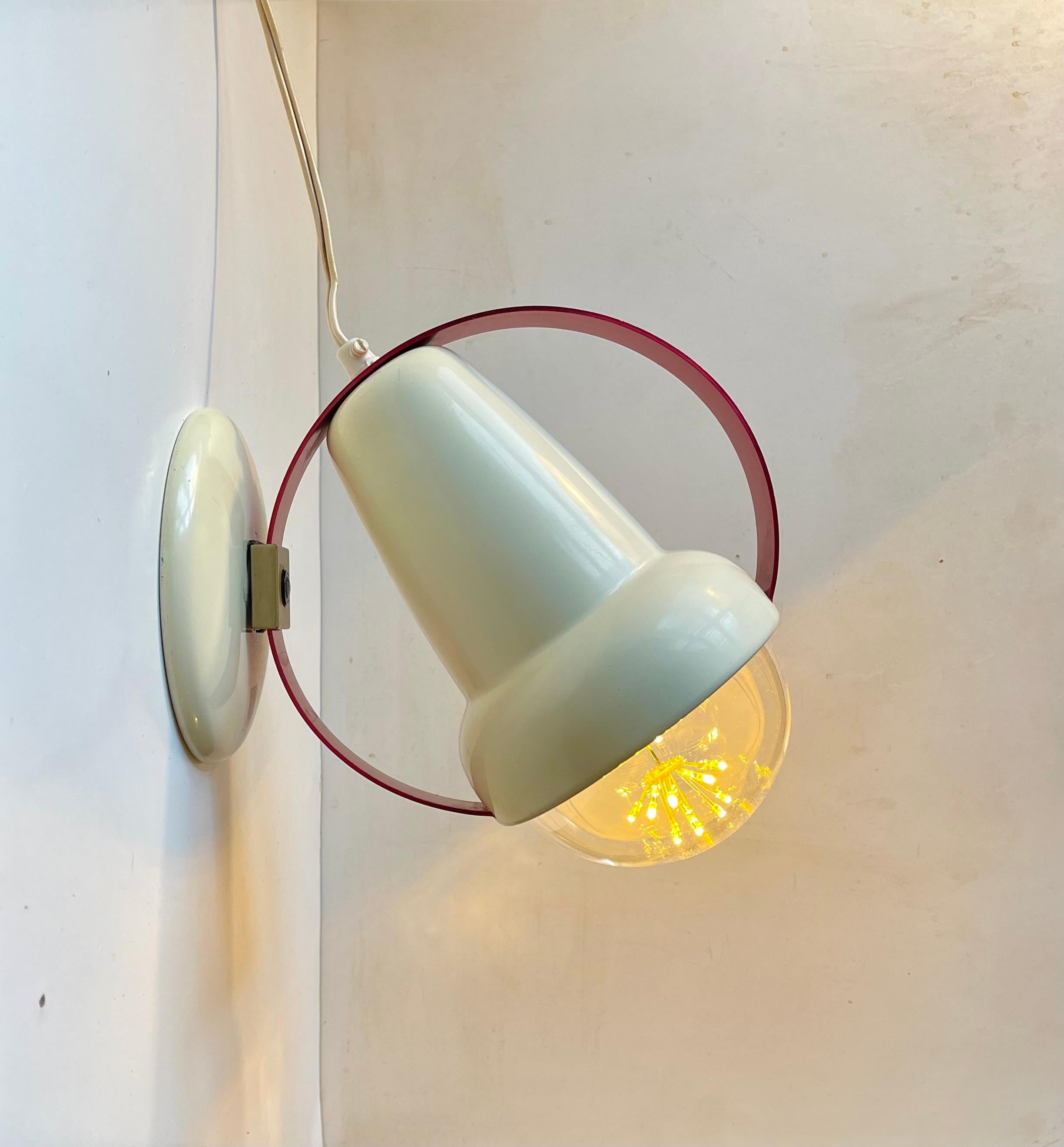 A pair of original Charlotte Perriand sun-lamps (Type 7529) up-cycled to wall or table lamp by our in-house electrician. Everything is original besides the sockets and new maxi-bulbs. They even retain their original cords/wire. The direction of the