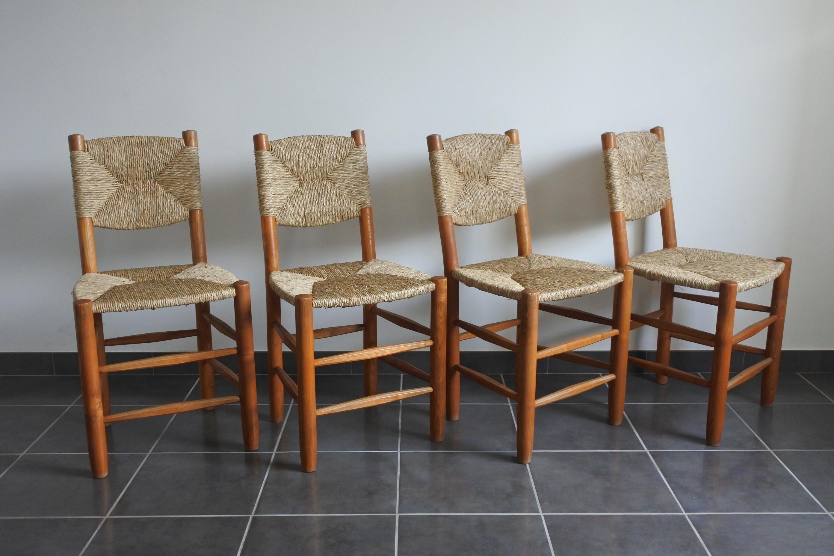 Set of 4 Bauche chairs by Charlotte Perriand.
Solid ash wood and straw.
Model number 19 with tilted back.
Edited by Steph Simon in the 1950s.
Literature: 
