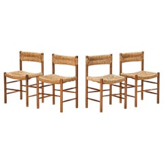 Ensemble de quatre chaises de salle à mangerordogne en teck et paille de Charlotte Perriand 