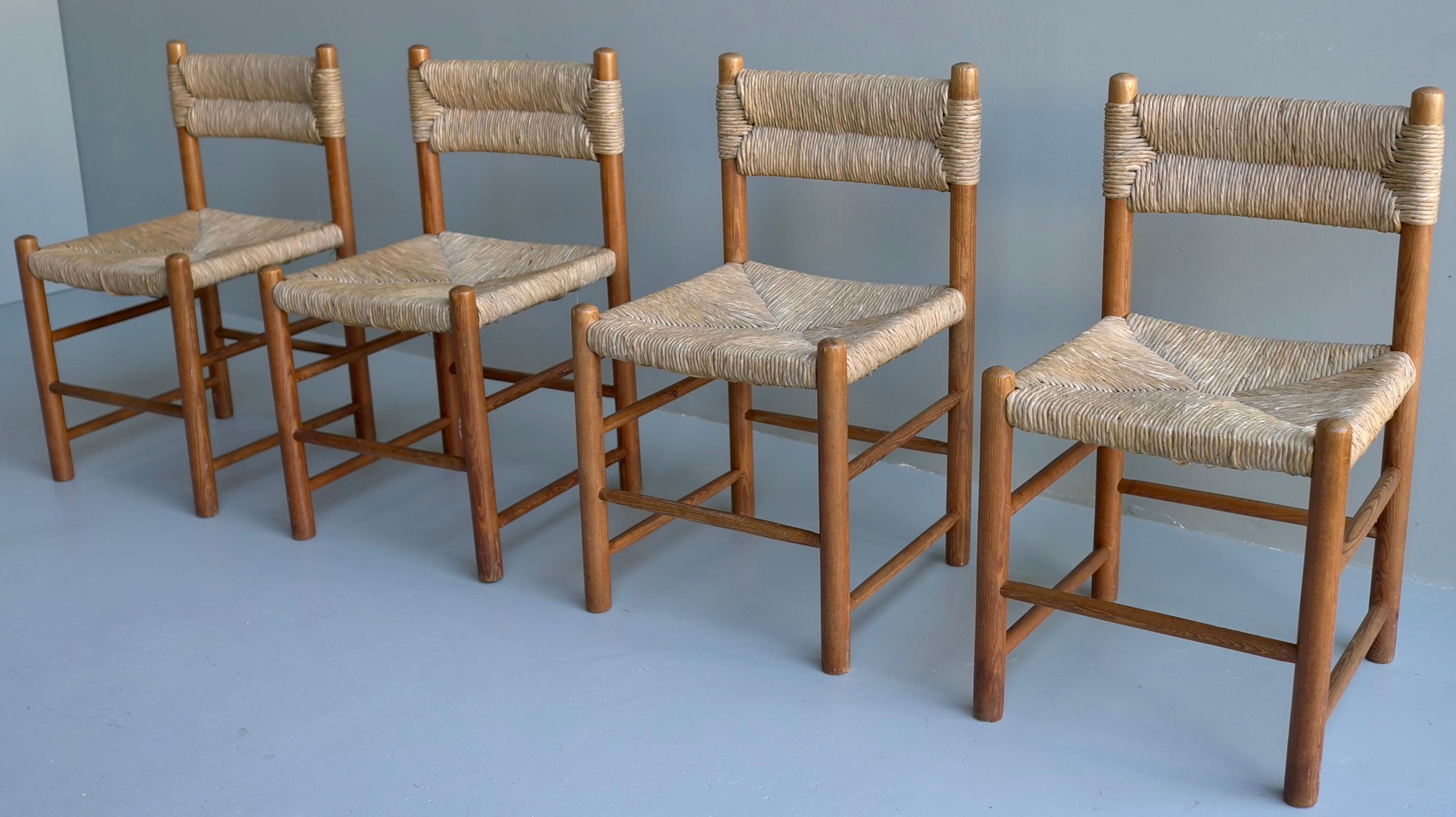 Charlotte Perriand, set of four cane and wood 