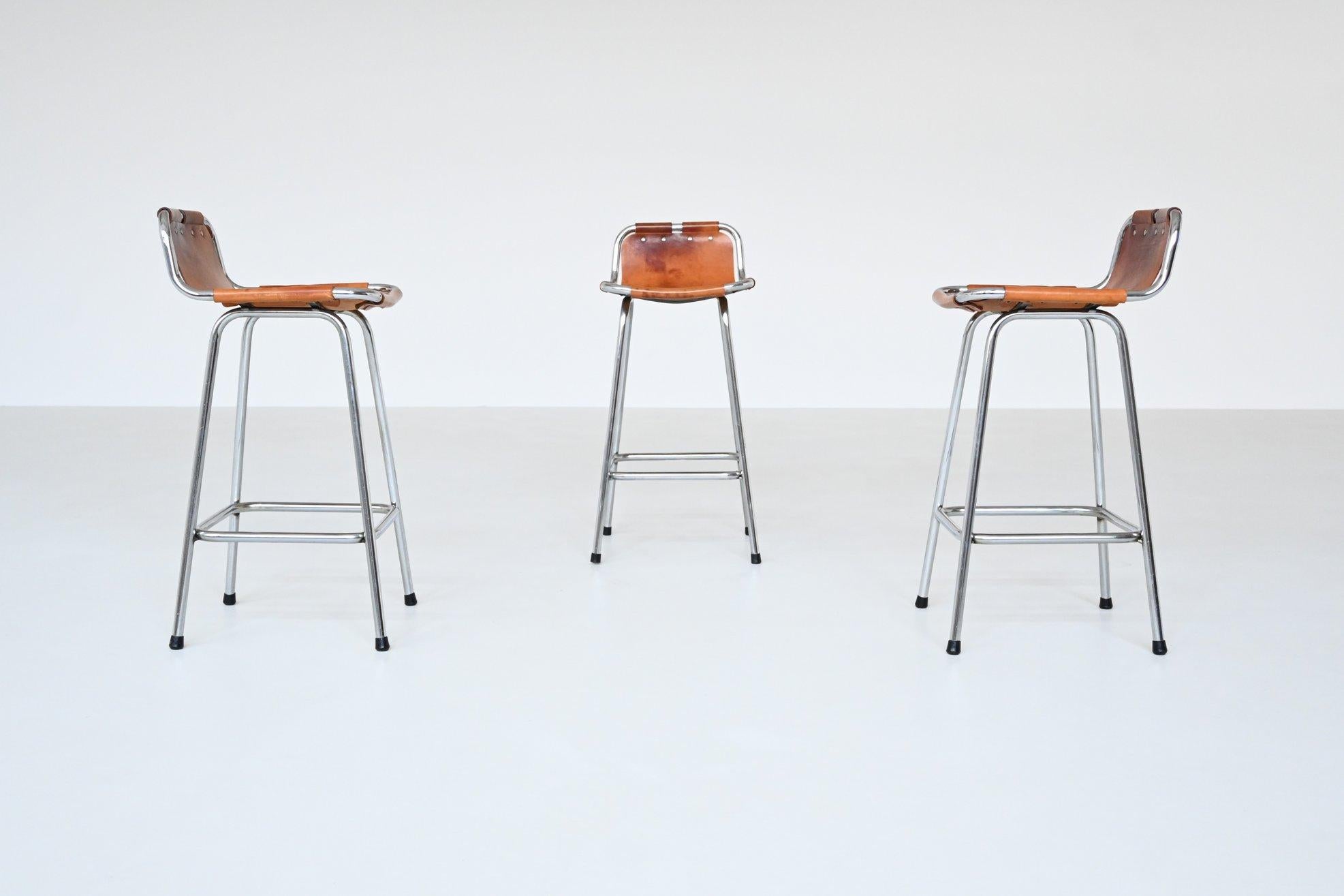 French Charlotte Perriand set of three bar stools in leather Les Arcs France 1960