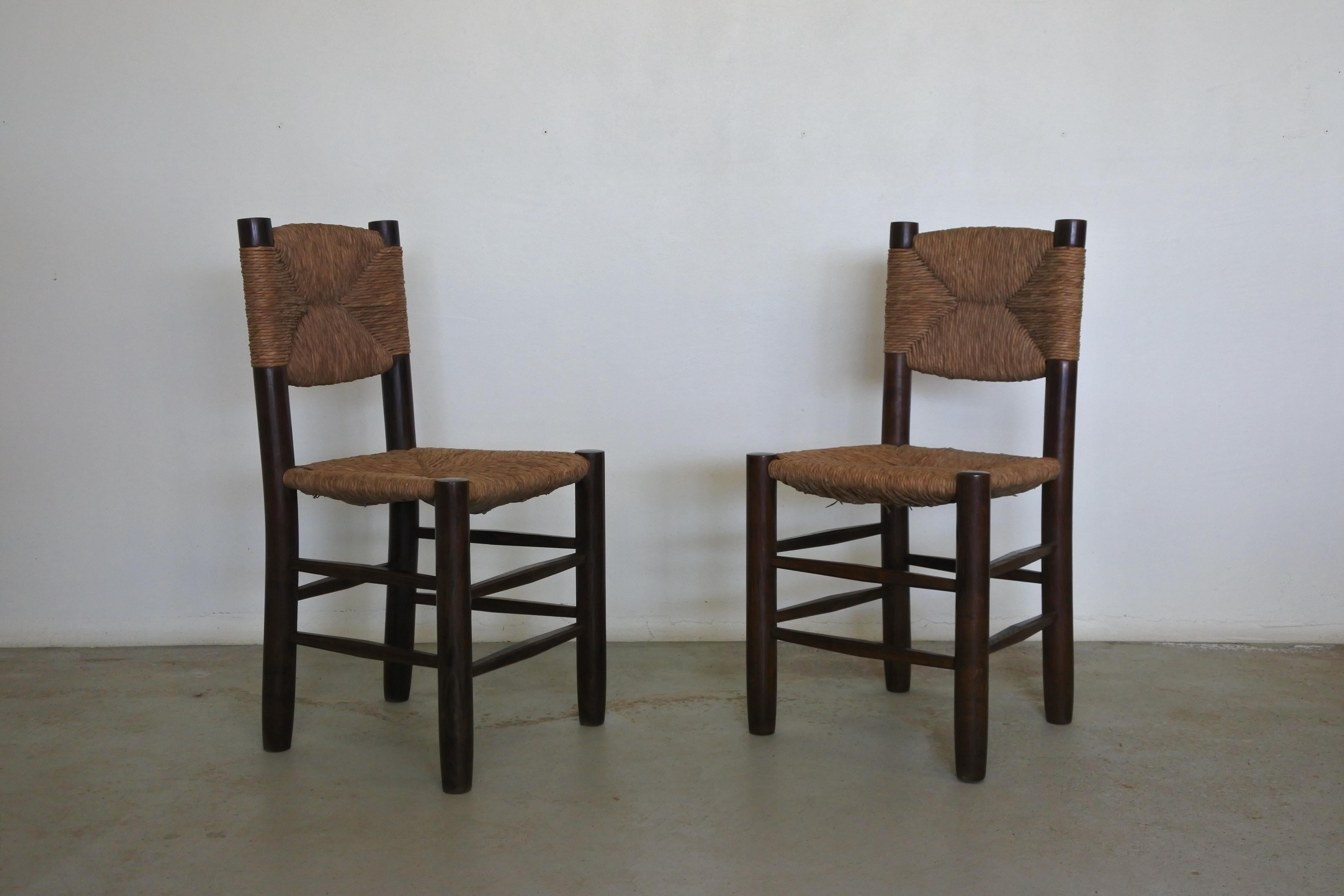 Set of 2 Bauche chairs by Charlotte Perriand.
Solid ash wood and straw.
Model number 19 with tilted back.
Made by Robert Sentou in the early 1950s.
Literature: 