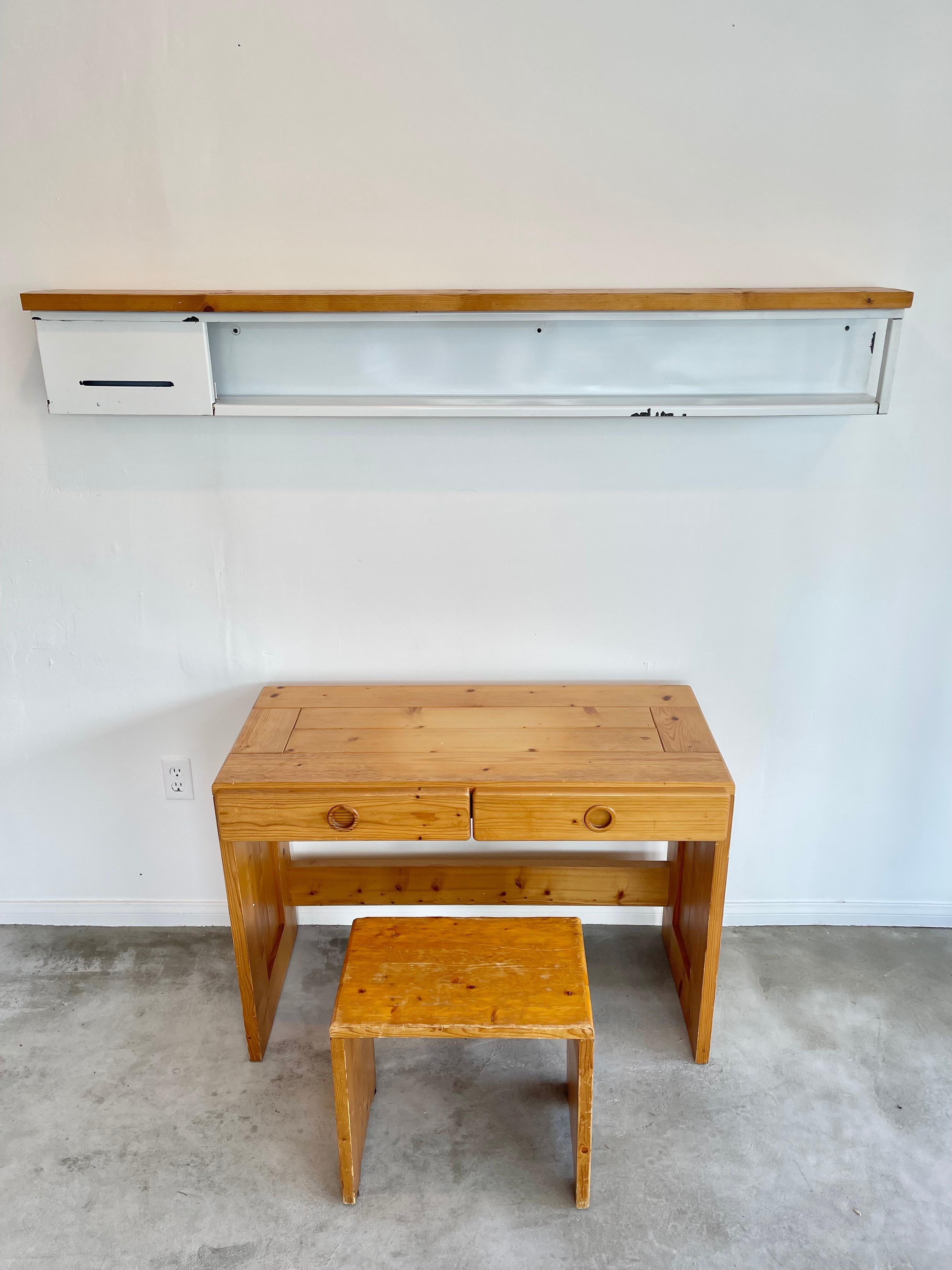 Rare Charlotte Perriand shelf made for Les Arcs ski resort. Circa 1960s. Solid slab of Pine wood secured onto a steel frame glazed in a white ceramic. Incredible patina and presence. Great vintage condition. Highly collectible piece of Charlotte