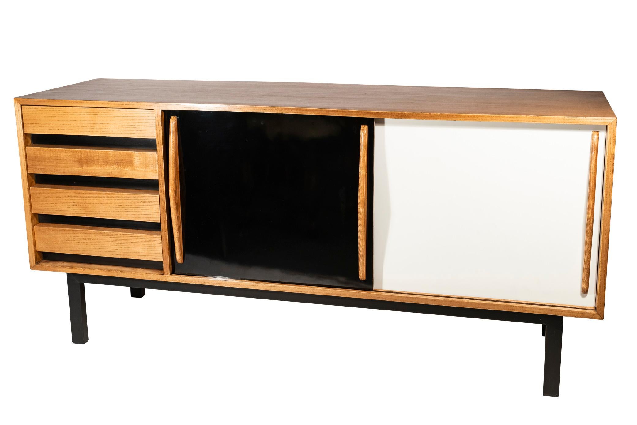 Charlotte Perriand (1903-1999), sideboard, France, circa 1958. 
Cité Cansado, Mauritania. 
Published by Steph Simon, France. Modèle Charlotte Perriand / Brevet SGDG. 

Measures: Height 70 cm, depth 45 cm, width 158 cm.