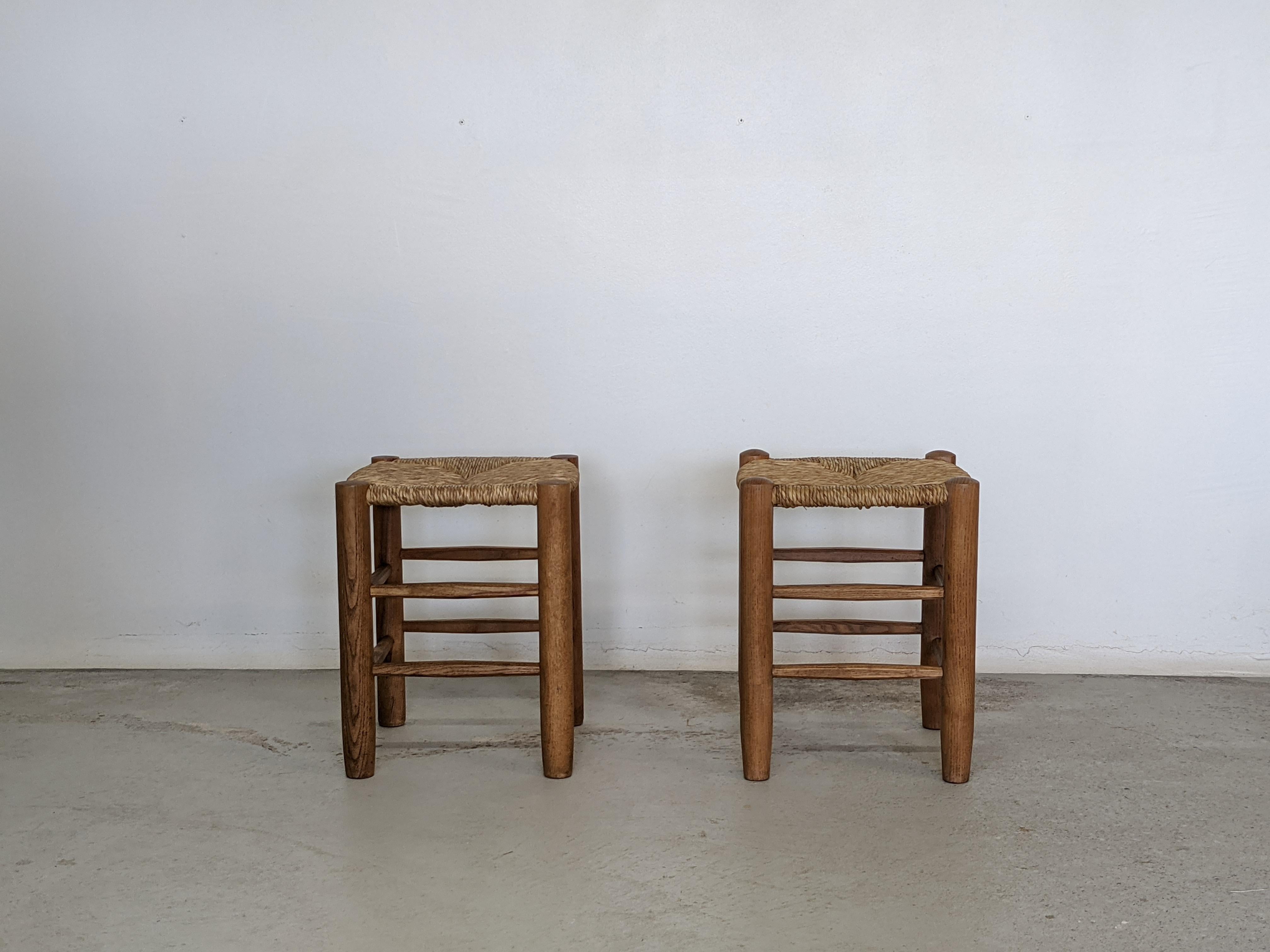 Solid ashwood stools by French renowned designer Charlotte Perriand.
Made by Georges Blanchon (Equipement de la Maison) in the early 1950s.
Model number 17.
Circular feet and handcrafted foot bars (characteristic of Perriand chairs, armchairs and