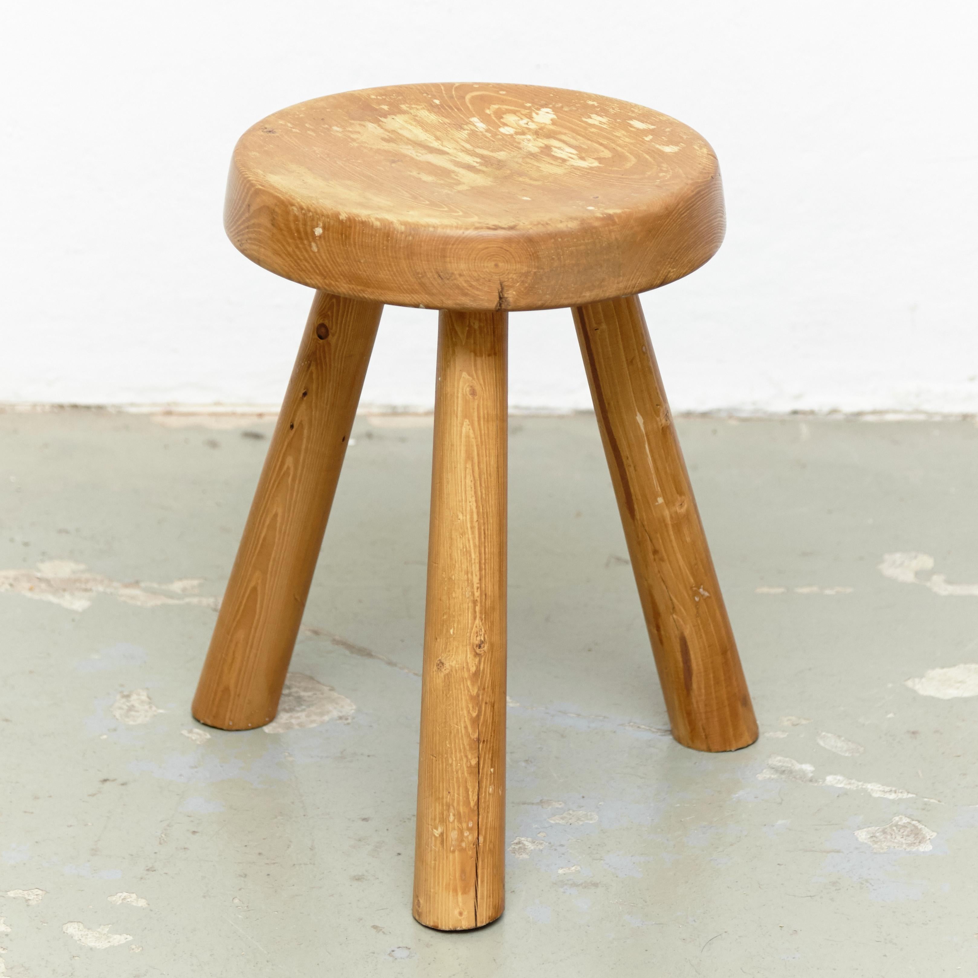 Stool designed by Charlotte Perriand, circa 1960 for Les Arcs.
Manufactured in France.
Pine wood seat.

In good original condition, preserving a beautiful patina. 

Charlotte Perriand (1903-1999) She was born in Paris in 1903 and attended the
