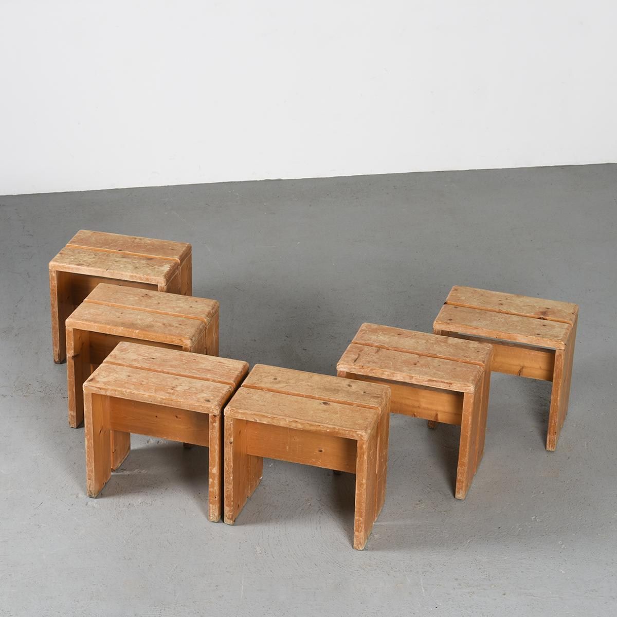 A rare set of six stools from les Arcs Ski resort by Charlotte Perriand.

Crafted with precision from solid pine, this set of six stools features an elegant inverted U shape and a charming patina. These stools were specifically selected as the