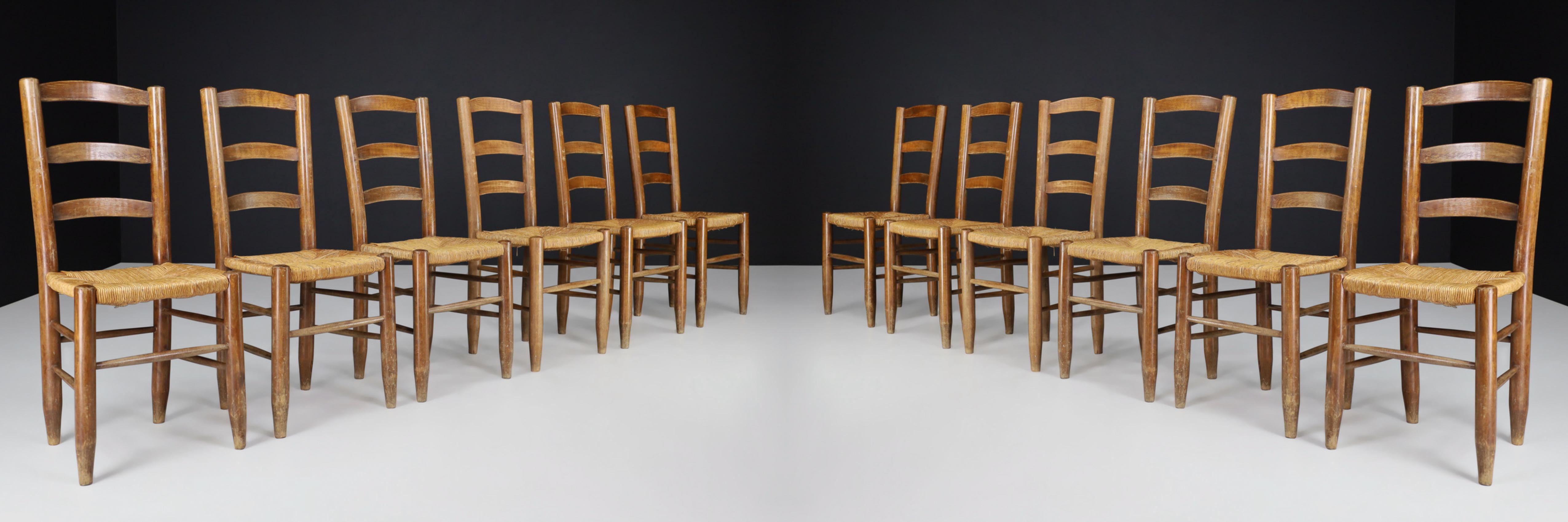 Charlotte Perriand Style Dining Chairs, France 1950s.

These solid beech and rush dining chairs show a lovely natural patina and are in excellent original condition. These chairs would be an eye-catching addition to any interior, such as a dining