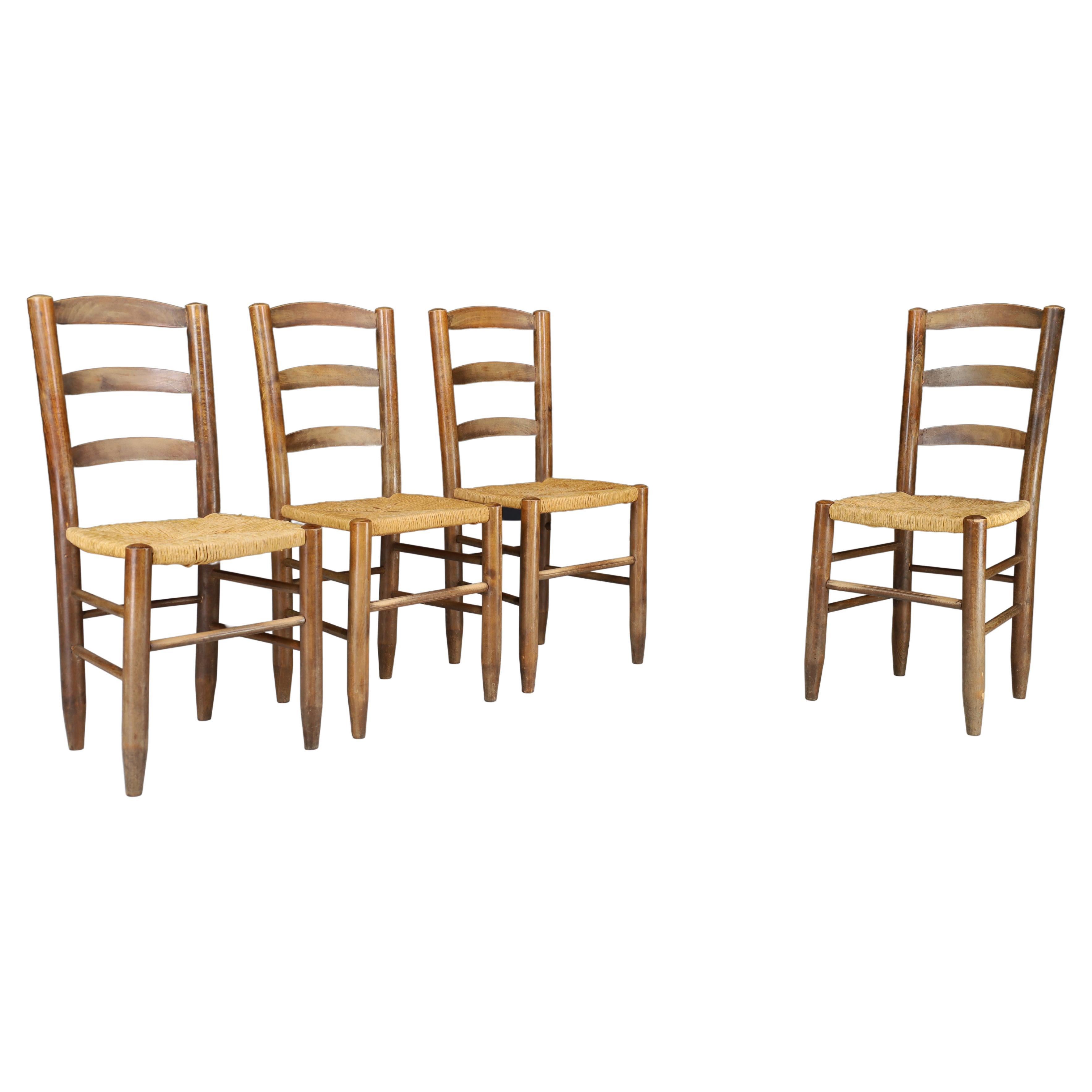 Ensemble de quatre chaises de salle à manger de style Charlotte Perriand, France, années 1950 en vente