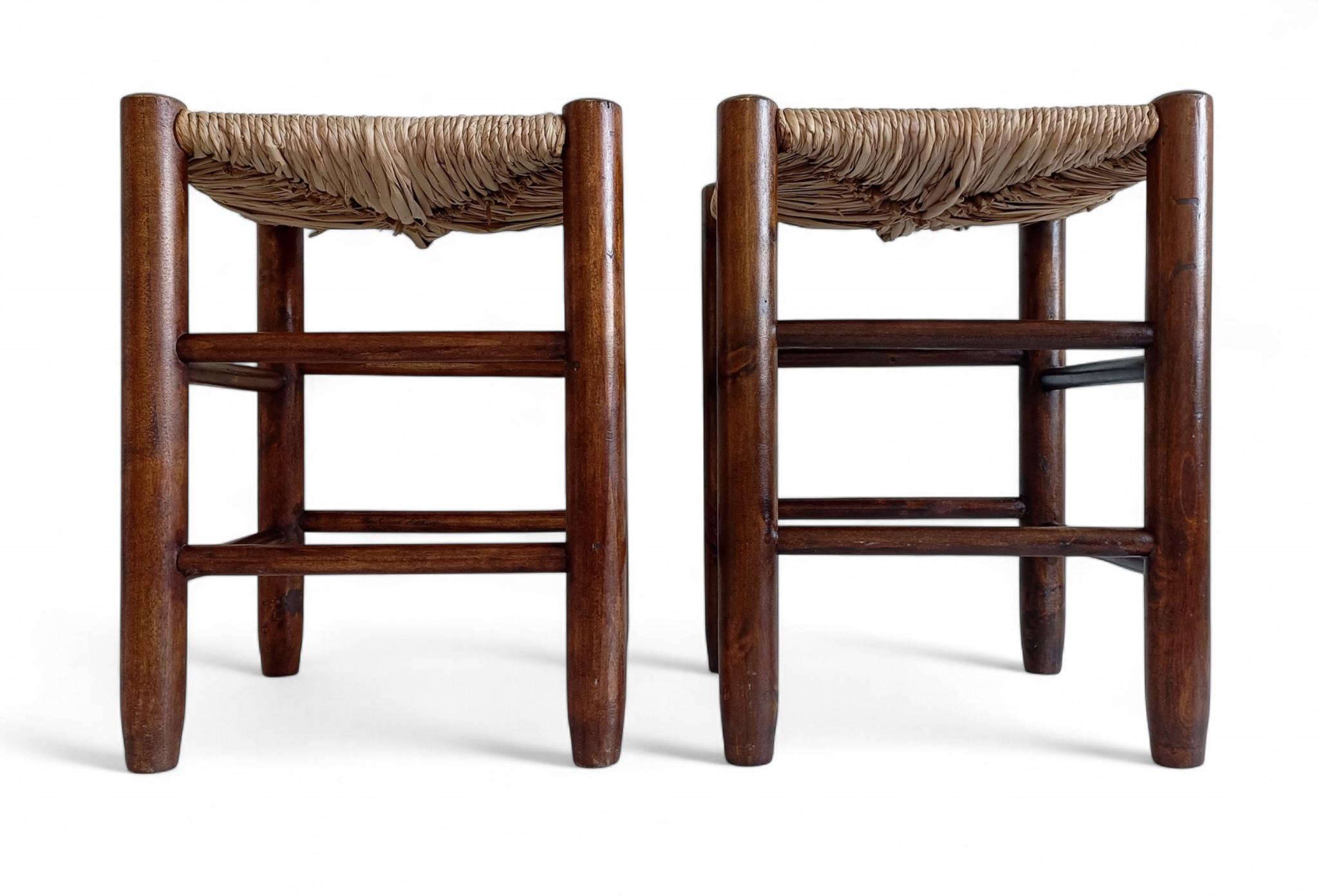 Pair of Charlotte Perriand Style Wood and Straw Stools, France, circa 1950s

Pair of tabouret stools in the manner of Charlotte Perriand, France, 1950s. Turned wood frames with woven rush seats. Classic French Provincial construction with clean,