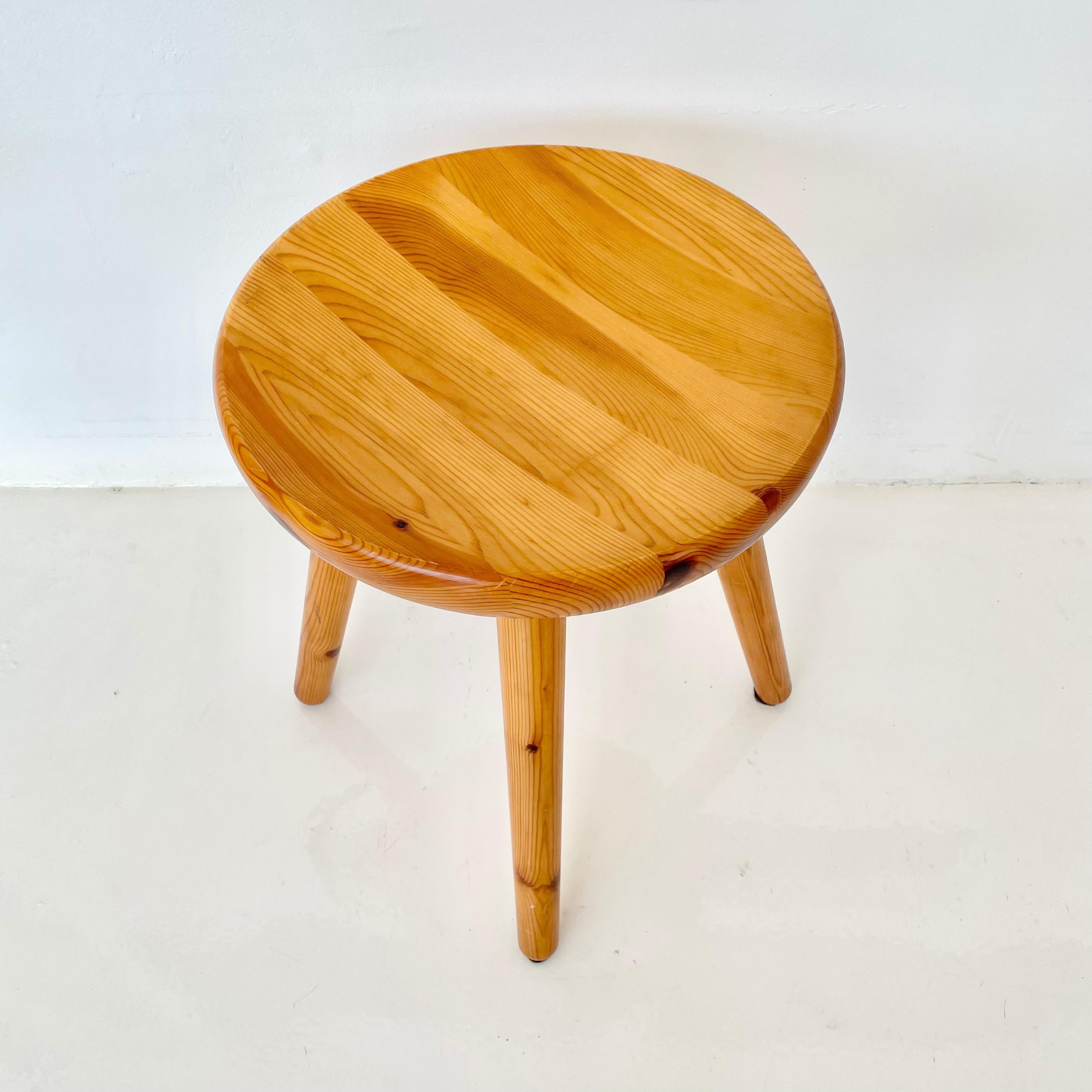 Collectible pine stools in the style of Charlotte Perriand. No screws or hardware used on stools. Beautiful joinery and grain details. Four available. Priced individually. Very good condition with slight wear and excellent patina.