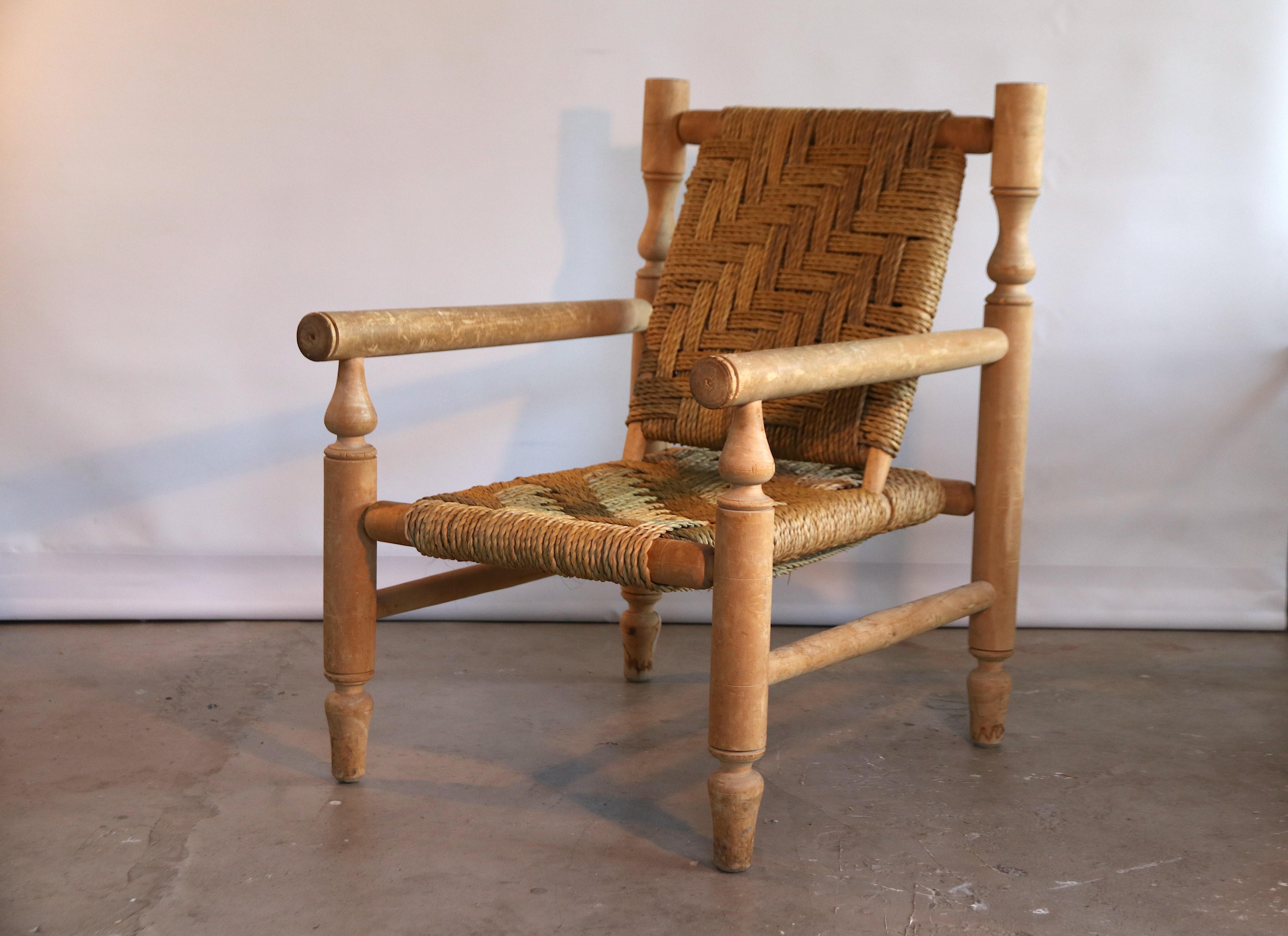French easy chair that is beautifully handcrafted without any use of nails or iron. The seat and back are made of a wonderfully hand braised sisal rope. The chair has a nice natural Ibiza style and feel to it. The frame is made of the distinguishing