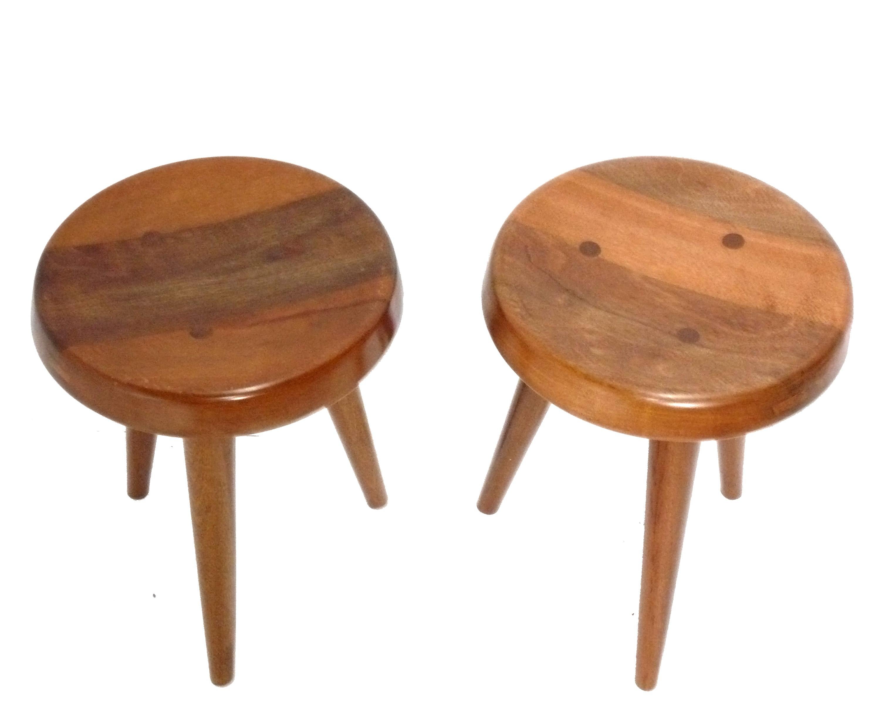 Sculptural Tripod Stools, in the style of Charlotte Perriand, France, circa 1990s. They are priced at $1200 each or $1950 for the pair. 