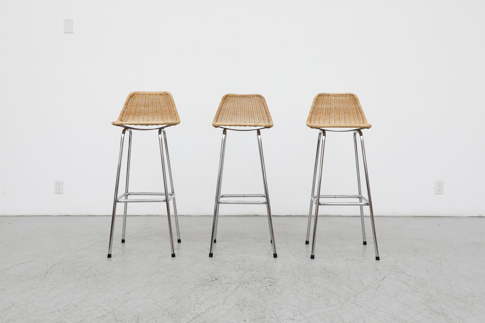 Mid-Century, Charlotte Perriand style wicker bar stools as designed by Dutch post war designer Dirk van Sliedregt for Rohe Noordwolde, a furniture maker that was widely renowned for their use of wicker, rattan bamboo in contemporary furniture. These