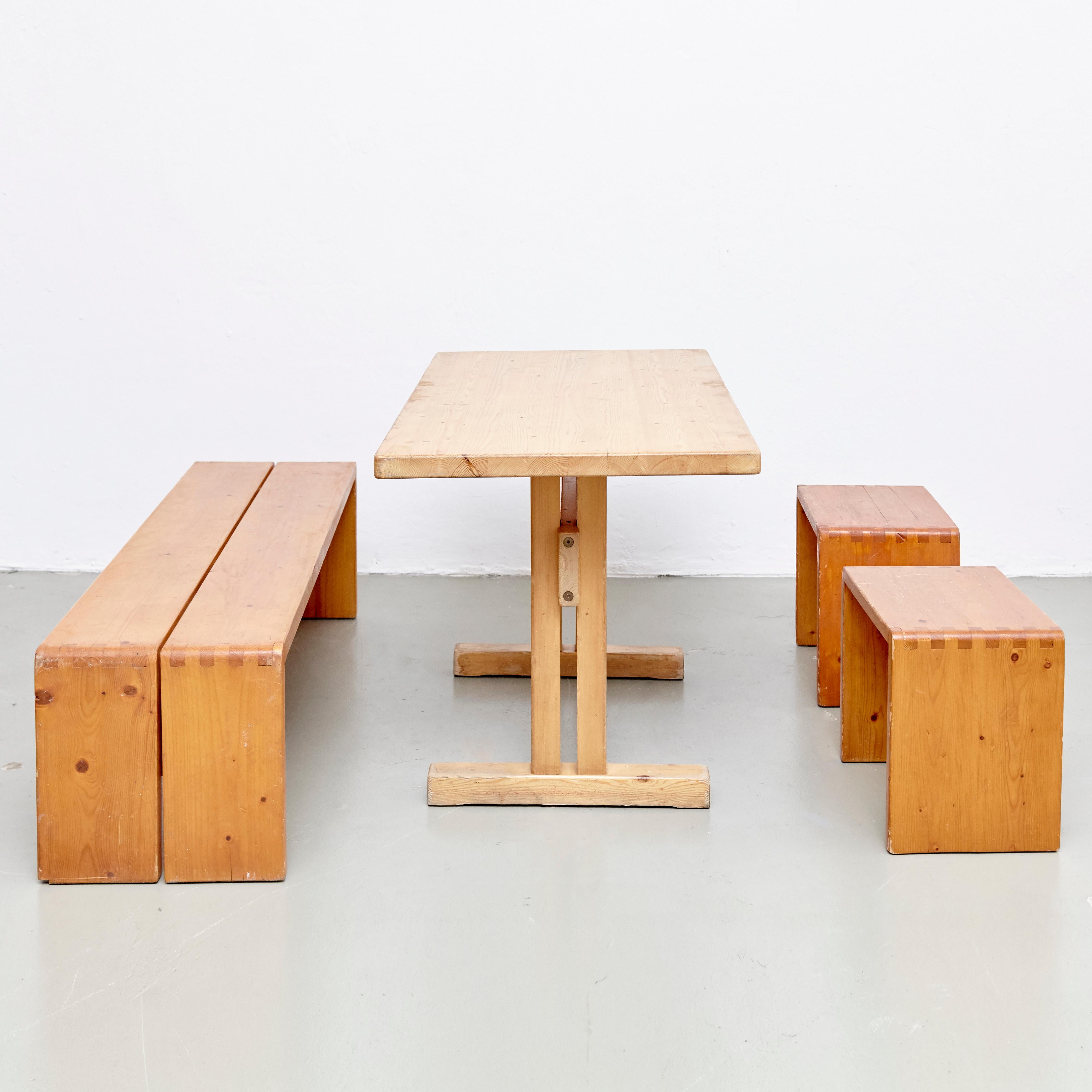 Set of table, stools and bench designed by Charlotte Perriand for Les Arcs ski resort, circa 1960, manufactured in France.

Pinewood.

In original condition, with minor wear consistent with age and use, preserving a beautiful patina.

Table: