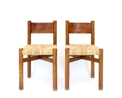 Charlotte Perriand Due sedie da pranzo Meribel in Oak e giunco Les Arcs