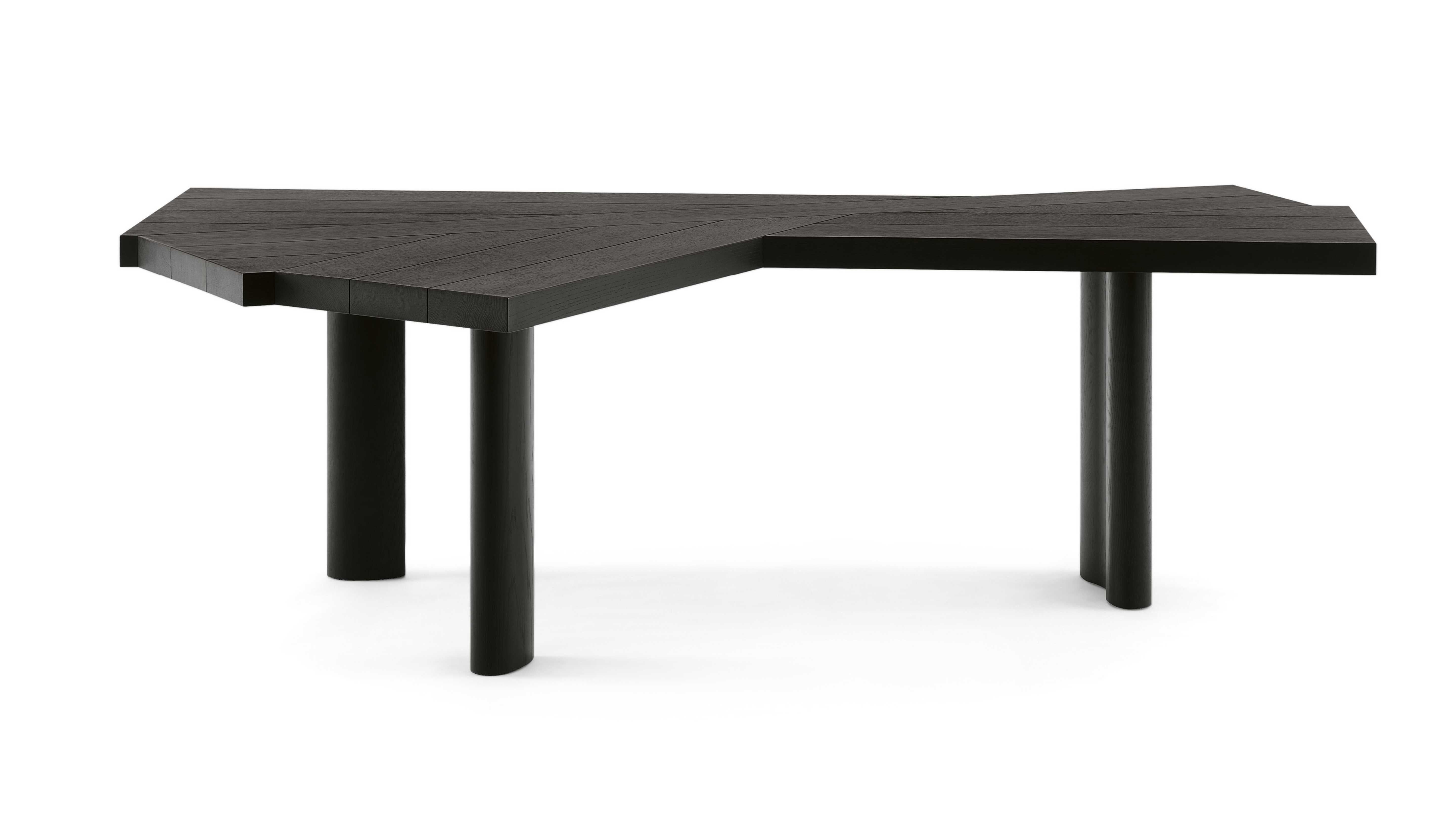 Price is dependent on the chosen material. Available in black stained oak or natural oak. A multifunctional table with a revolutionary design, whose shape and use are uniquely different from all the other tables completely sums up l’art de vivre of