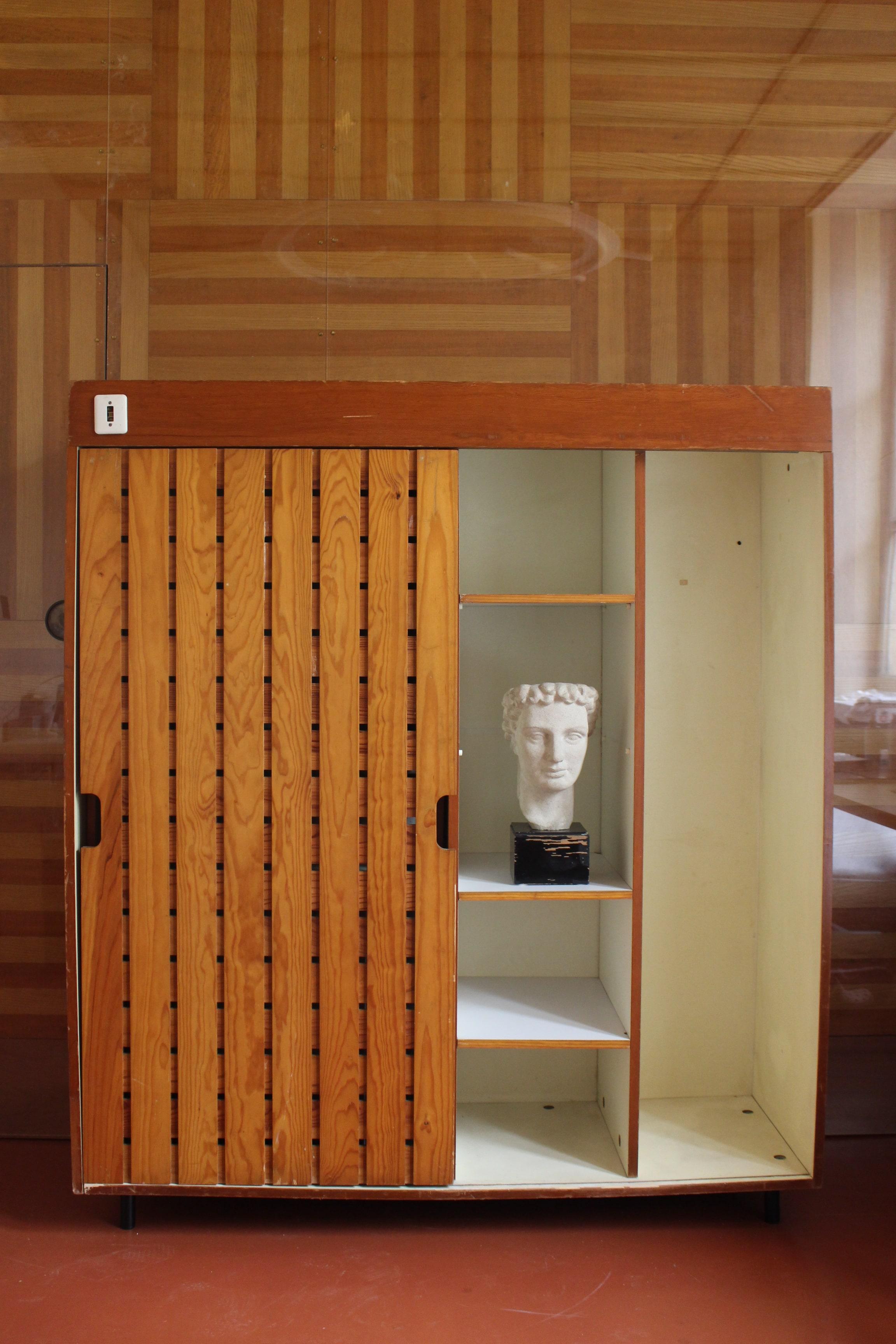 Charlotte Perriand wardrobe design and installed in Les Arcs Ski Lodge in the french alps in 1967. It offers a large amount of storage with a single sliding door made in solid pinne to reveal one large compartment on the left, and two large