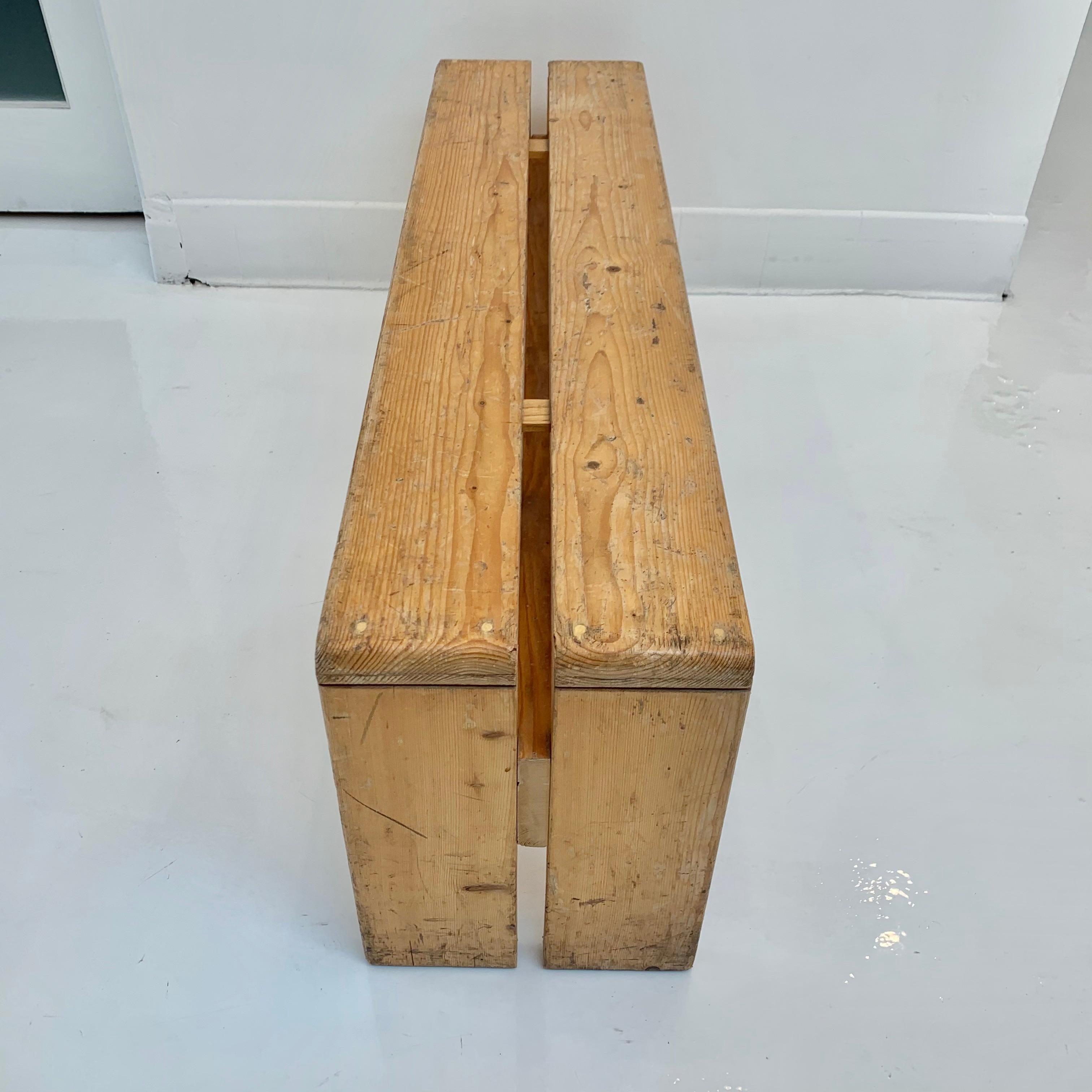 Classic pine, 3 seater bench designed by Charlotte Perriand for the Les Arcs Ski Resort in France. Just under 4 feet long. Varying patina and wear to each bench. 

3  benches available. Priced individually. 

  
