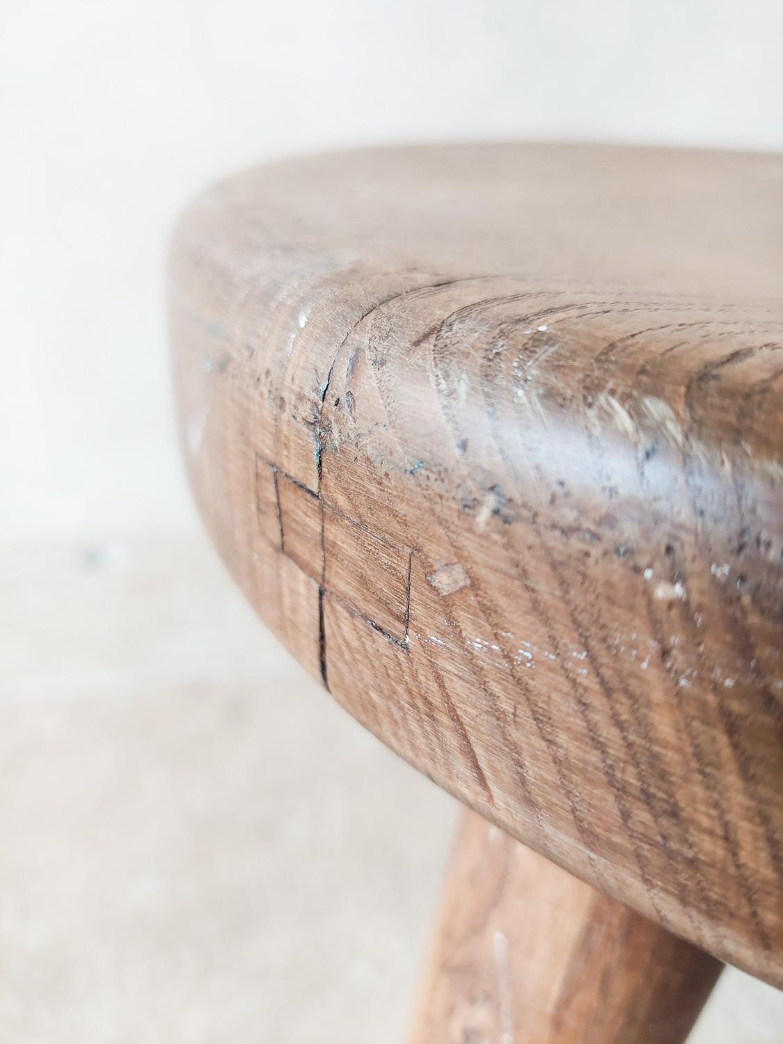 Charlotte Perriand, Berger stool for Steph Simon Galleries, circa 1950s. This solid oak wood tabouret tripod, has visible honest aging and patina as you can see on the close-up photo's. The typical connection, used for turning the wood form, is